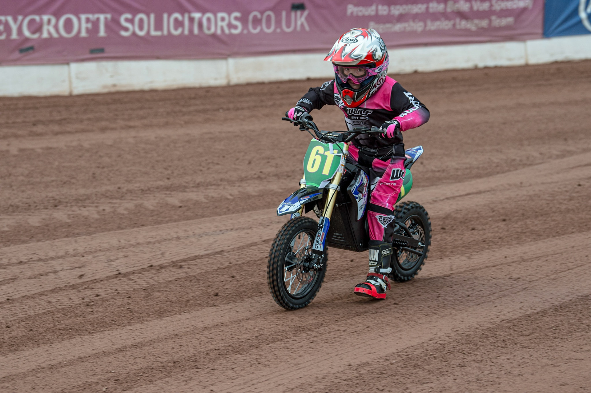 MANCHESTER, UK. JUN 13TH 8 year old rider Jess Cox on her electric bike gives a demonstration ride. Jess rides Grass Track in the Cadet category, and is trying an electric bike for racing during the SGB Premiership match between Belle Vue Aces and Wolverhampton  Wolves at the National Speedway Stadium, Manchester on Monday 13th June 2022. (Credit: Ian Charles | MI News)