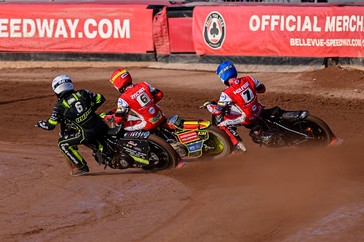 Ipswich Witches' Dan Thompson  in White rides inside Belle Vue Aces' Tate Zischke  in Red and Belle Vue Aces' Jake Mulford  in Blue during the Rowe Motor Oil Premiership match between Belle Vue Aces and Ipswich Witches at the National Speedway Stadium, Manchester on Monday 30th June 2025. (Photo: Ian Charles | MI News)
