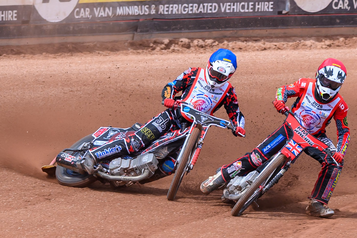 BRITISH YOUTH CHAMPIONSHIP (500cc): Kayden Mundy (8) in Red rides inside Dylan Huthwaite (9)  in Blue who then falls during the British Youth Speedway Championship at the National Speedway Stadium, Manchester on Sunday 10th May 2026. (Photo: Ian Charles | MI News)