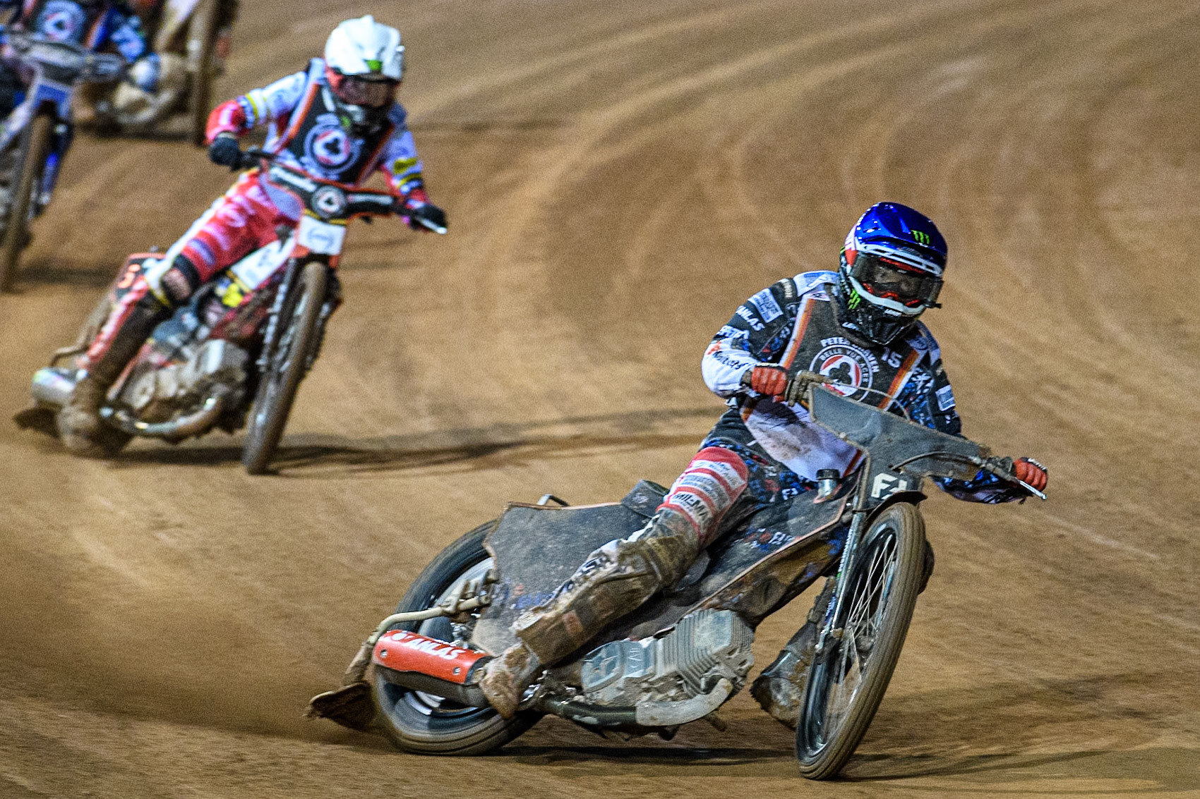 Freddie Lindgren in Blue leading Dan Bewley in White during the Peter Craven Memorial Trophy at the National Speedway Stadium, Manchester on Monday 17th March 2025. (Photo: Ian Charles | MI News)