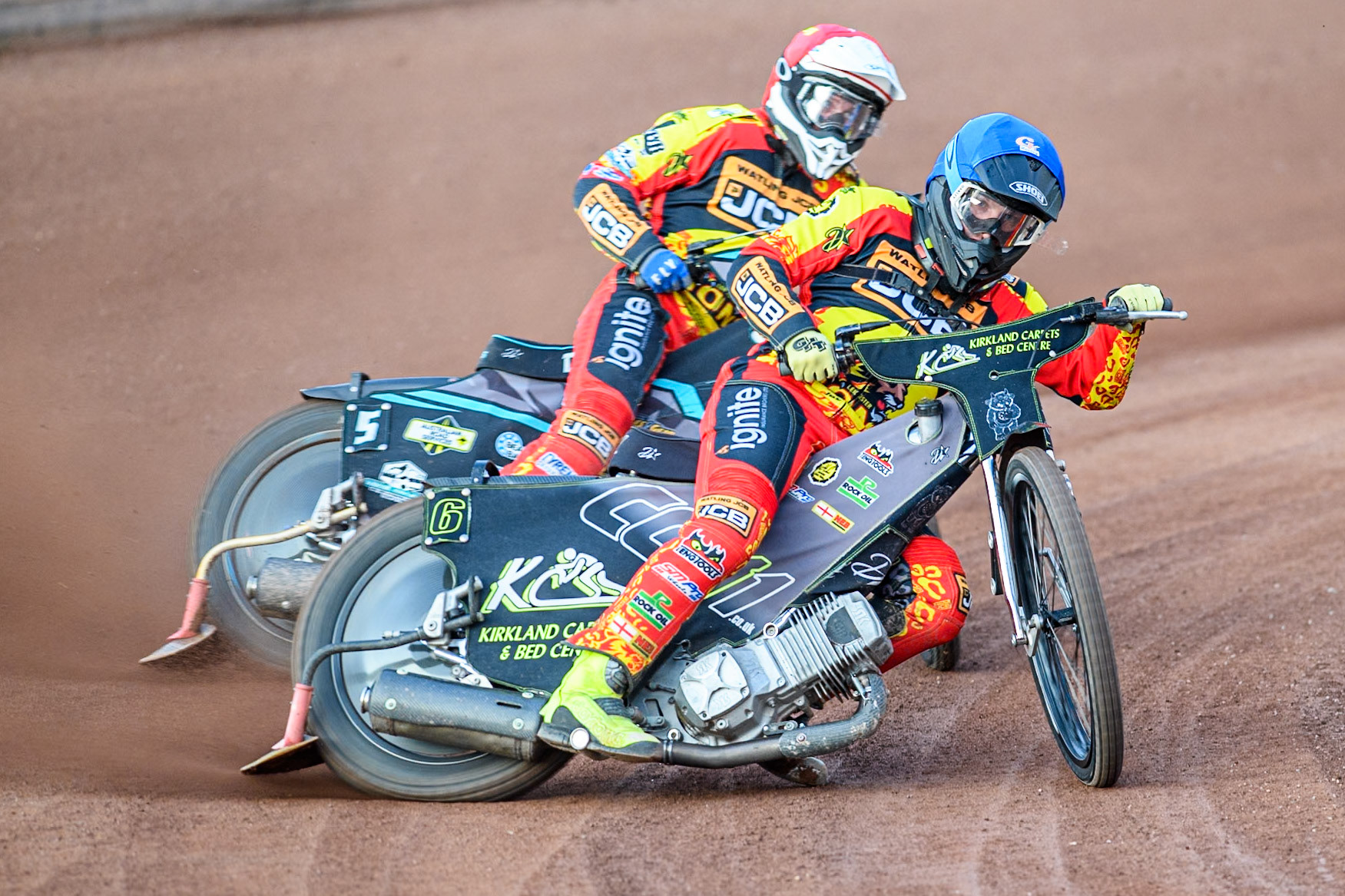 Leicester Lions' Craig Cook in Blue leading team mate Ryan Douglas during the Rowe Motor Oil Premiership match between Leicester Lions and Belle Vue Aces at the Pidcock Motorcycles Arena, Leicester on Thursday 25th July 2024. (Photo: Ian Charles | MI News)