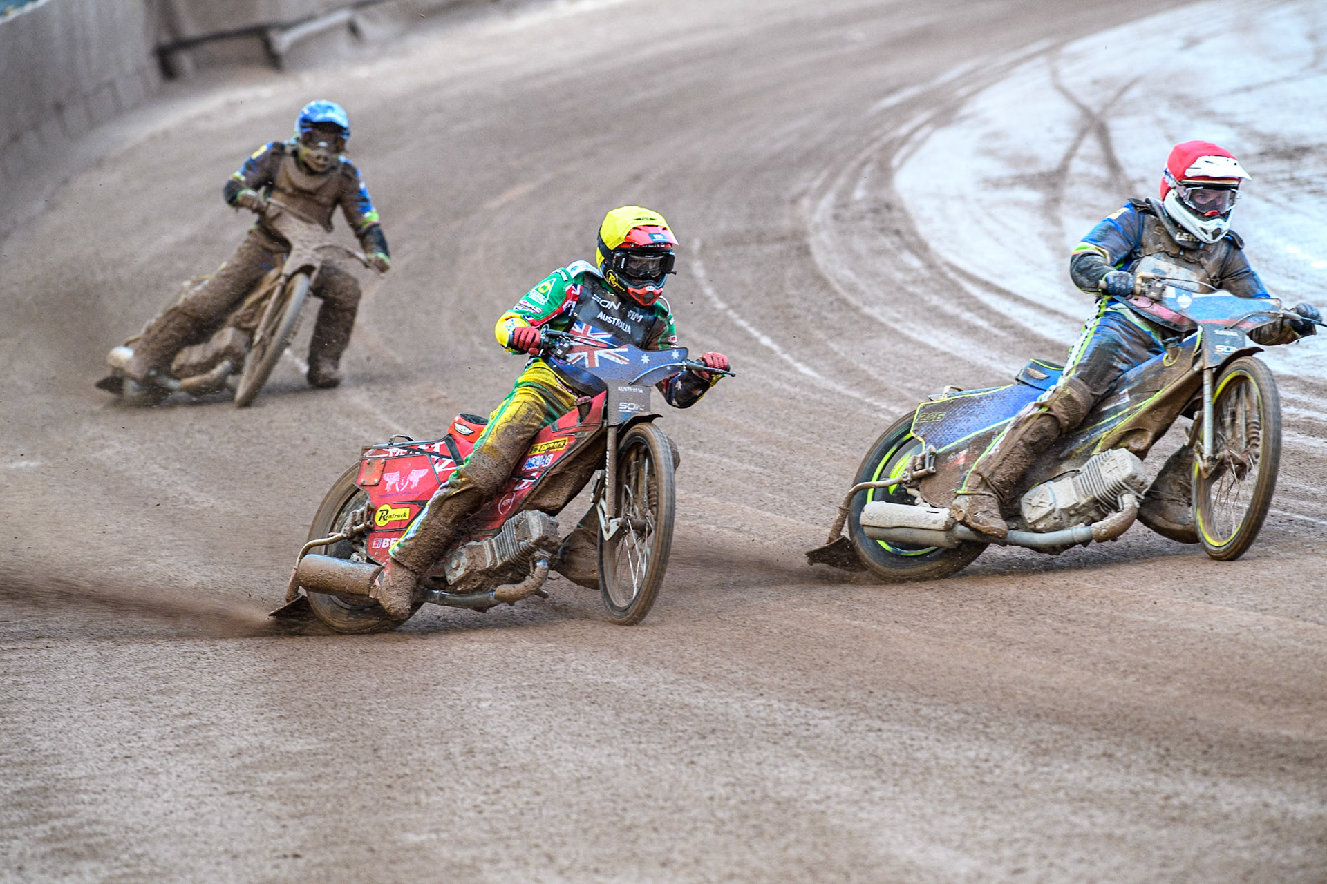 Matic Ivacic of Slovenia in Red rides inside Max Fricke of Australia in Yellow with Matic Ivacic of Slovenia in Blue behind during the Monster Energy FIM Speedway of Nation Semi Final 2 at the National Speedway Stadium, Manchester on Wednesday 10th July 2024. (Photo: Ian Charles | MI News)