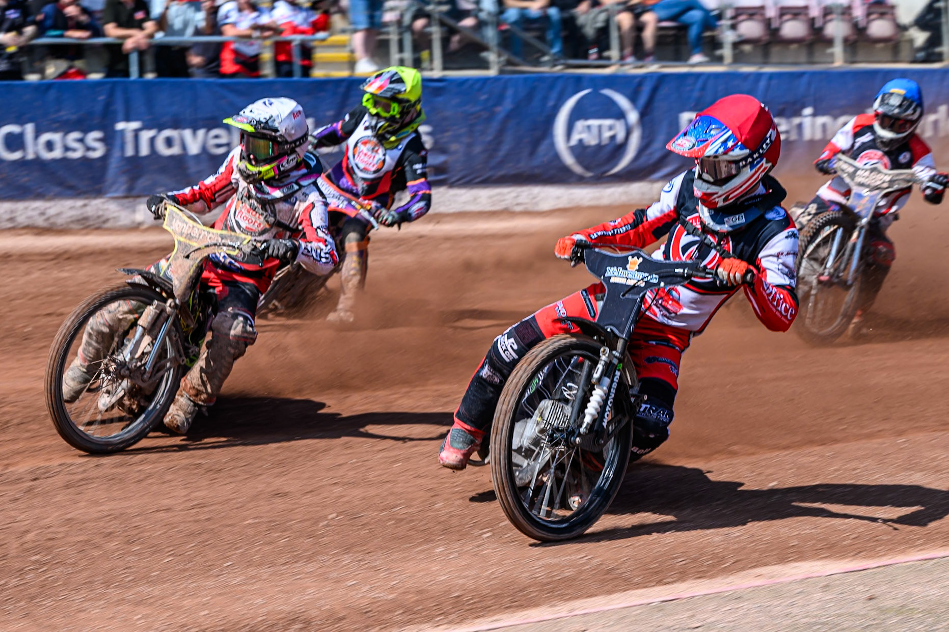 Freddy Hodder of Belle Vue Colts  in Red rides inside Ace Pijper of Middlesborough Tigers in White with Elliot Kelly of Middlesborough Tigers  in Yellow and Harry Fletcher of Belle Vue Colts  in Blue behind during the WSRA National Development League match between Belle Vue Colts and Middlesbrough Tigers at the National Speedway Stadium, Manchester on Sunday 10th August 2025. (Photo: Mark Fletcher | MI News)