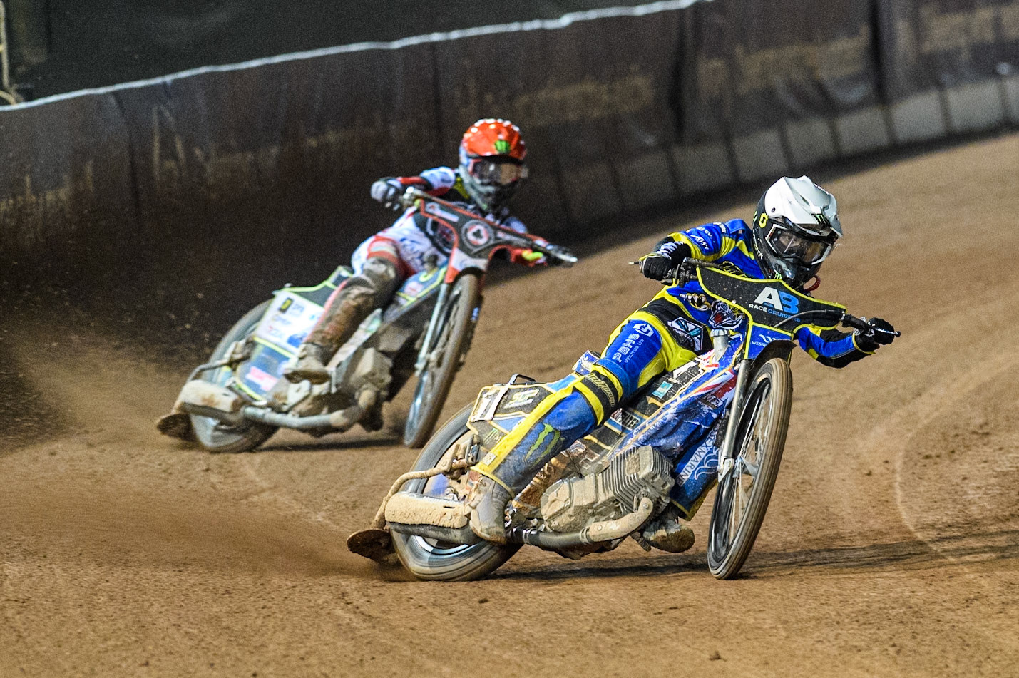 Sheffield Tigers' Jack Holder in White leading Belle Vue Aces' Jaimon Lidsey  in Red during the Rowe Motor Oil Premiership Play Off Semi Final 2, 1st Leg match between Belle Vue Aces and Sheffield Tigers at the National Speedway Stadium, Manchester on Monday 16th September 2024. (Photo: Ian Charles | MI News)