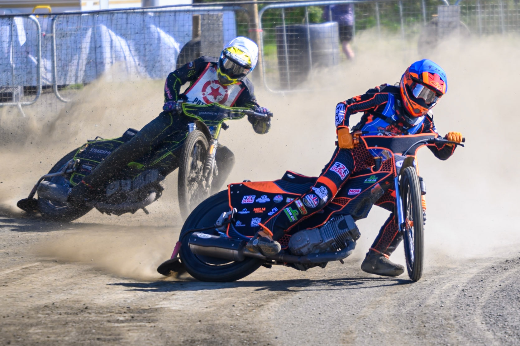 Jack Smith of Buxton Bulls in Blue leading Luke Harris of Buxton Bulls in White during the National Development League Challenge match between Buxton Bulls and Stoke Potters at Hi-Edge Speedway, Buxton on Sunday 24th May 2026. (Photo: Ian Charles | MI News)