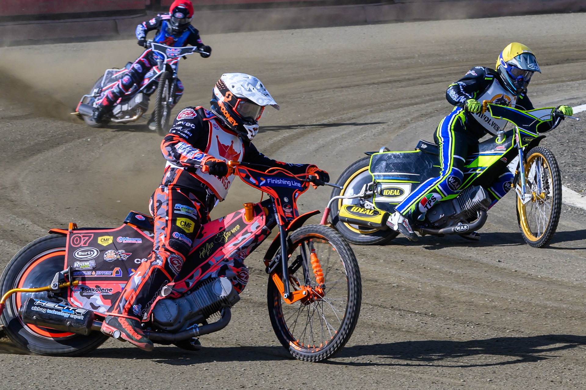 Alex Spooner of 'The Kings' in White rides outside Kieran Douglas of 'The Wolves'  in Yellow with Jack Shimelt of Buxton Bulls in Red behind  during the Regina Chains Fours at Buxton Speedway, Buxton on Sunday 5th April 2026. (Photo: Ian Charles | MI News)