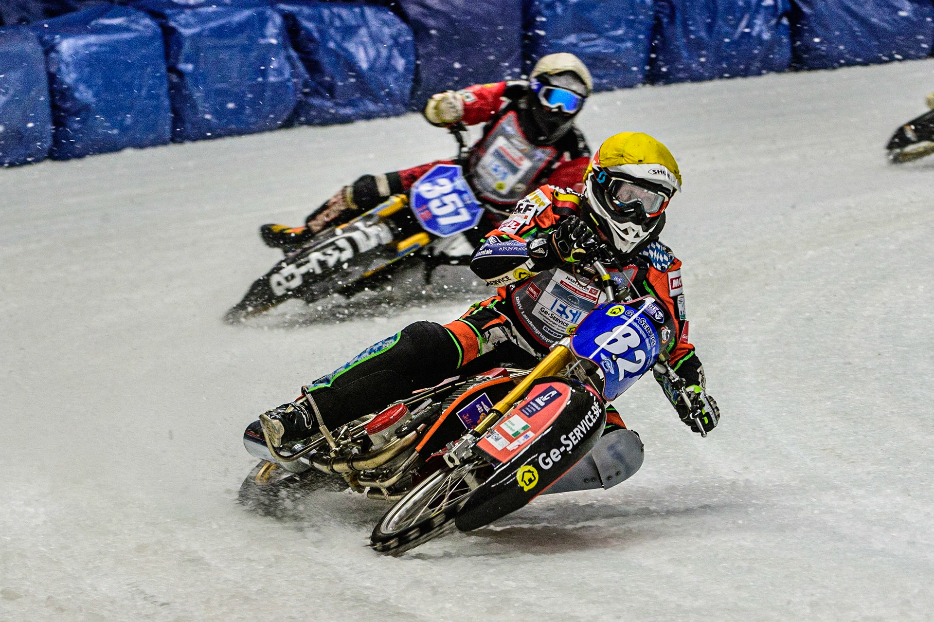 Markus Jell (82) (Yellow) leads Jo Saetre (357) (White) during the Ice Speedway Gladiators World Championship Final 1 at Max-Aicher-Arena, Inzell, Germany on Saturday 18th March 2023. (Photo: Ian Charles | MI News)