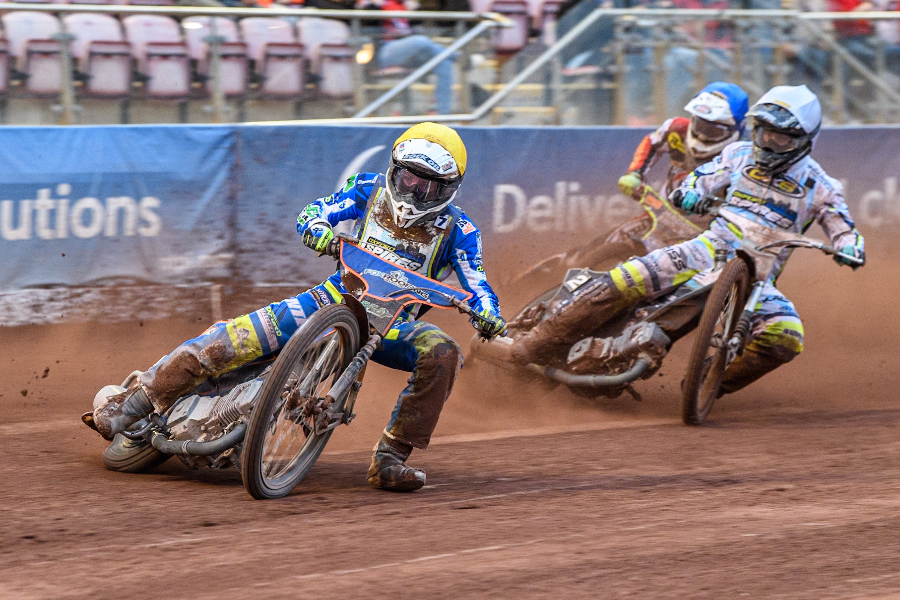Oxford Spires' Luke Killeen  in Yellow leading team mate Erik Riss in White and Belle Vue Aces' guest Jake Mulford  in Blue during the Rowe Motor Oil Premiership match between Belle Vue Aces and Oxford Spires at the National Speedway Stadium, Manchester on Monday 22nd July 2024. (Photo: Ian Charles | MI News)