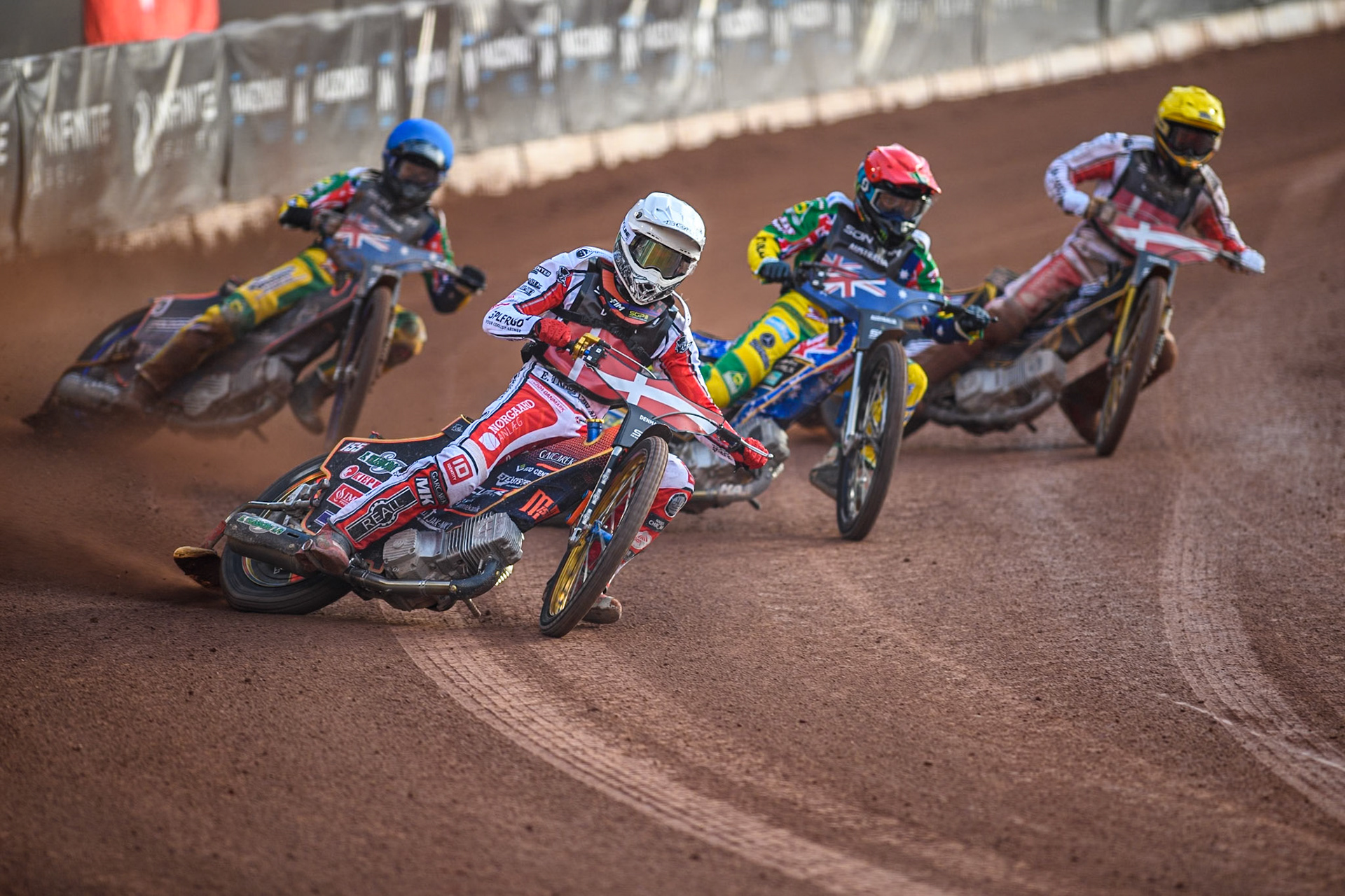 DENMARK v AUSTRALIA: Mikkel Michelsen of Denmark in White leading Jack Holder of Australia in Red, Brady Kurtz of Australia in Blue and Anders Thomsen of Denmark in Yellow during the Monster Energy FIM Speedway of Nation Final at the National Speedway Stadium, Manchester on Saturday 13th July 2024. (Photo: Ian Charles | MI News)