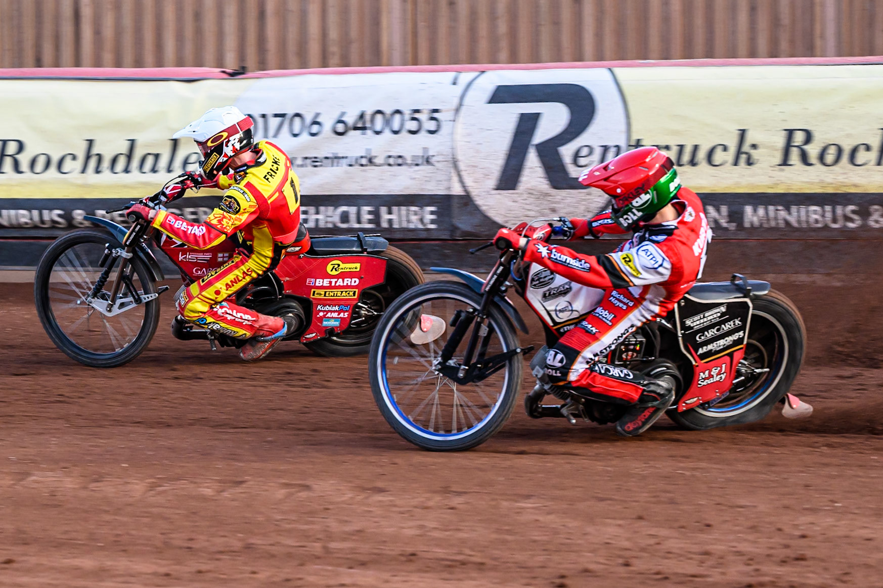 Belle Vue Aces' Brady Kurtz in Red chases Leicester Lions' Max Fricke  in White during the Rowe Motor Oil Premiership match between Belle Vue Aces and Leicester Lions at the National Speedway Stadium, Manchester on Monday 14th July 2025. (Photo: Ian Charles | MI News)
