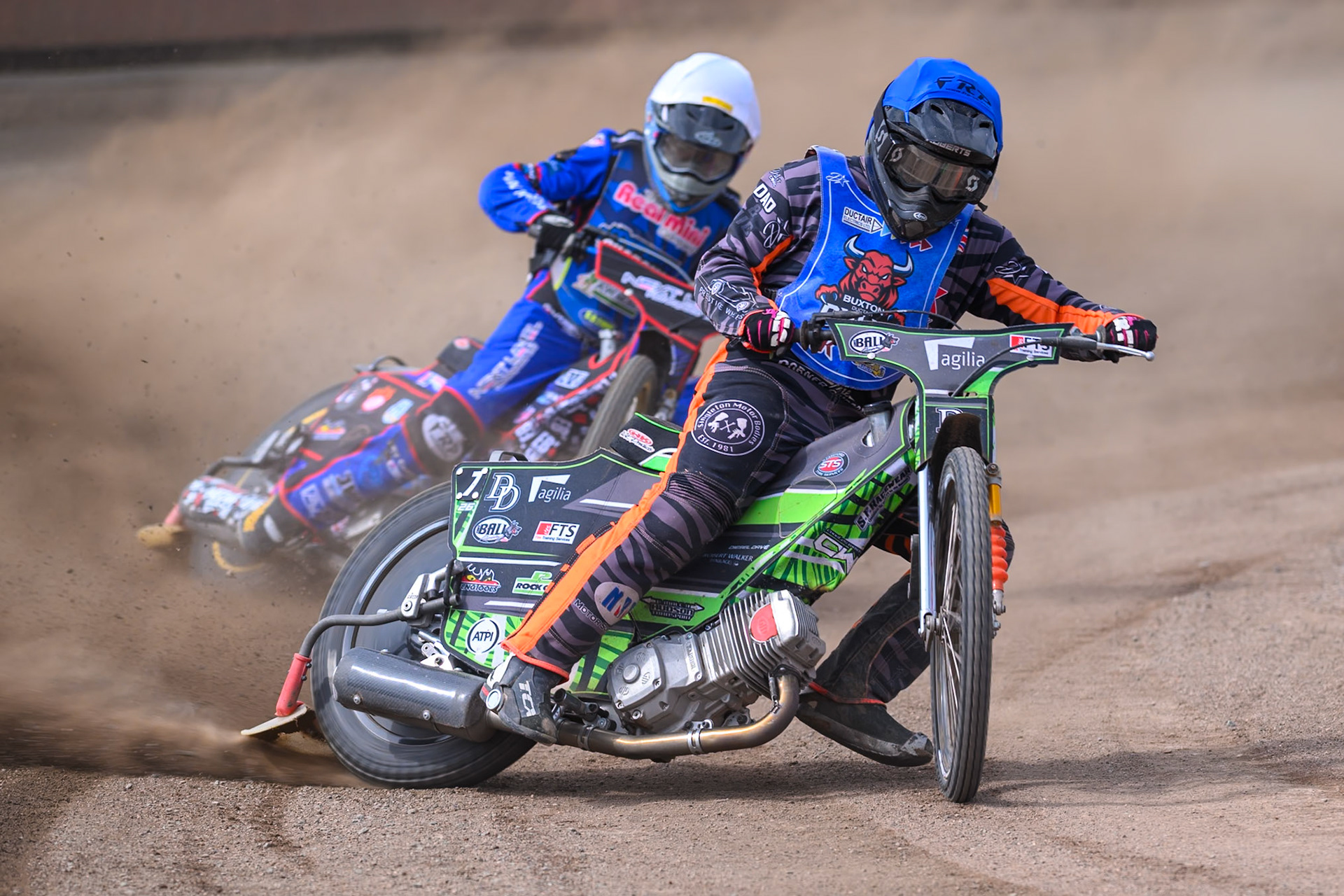 Jack Roberts of Buxton Bulls in Blue leading Emerson Betty of Oxford Chargers in White during the WSRA National Development League match between Buxton Bulls and Oxford Chargers at Hi-Edge Speedway, Buxton on Sunday 2nd August 2026. (Photo: Ian Charles | MI News)