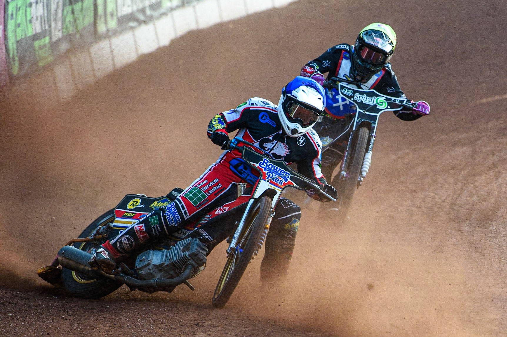 MANCHESTER, UK. JULY 23RD  Paul Bowen  (Blue) leads \’es2\ (Yellow) during the National Development League match between Belle Vue Colts and Eastbourne Seagulls at the National Speedway Stadium, Manchester on Friday 23rd July 2021. (Credit: Ian Charles | MI News)