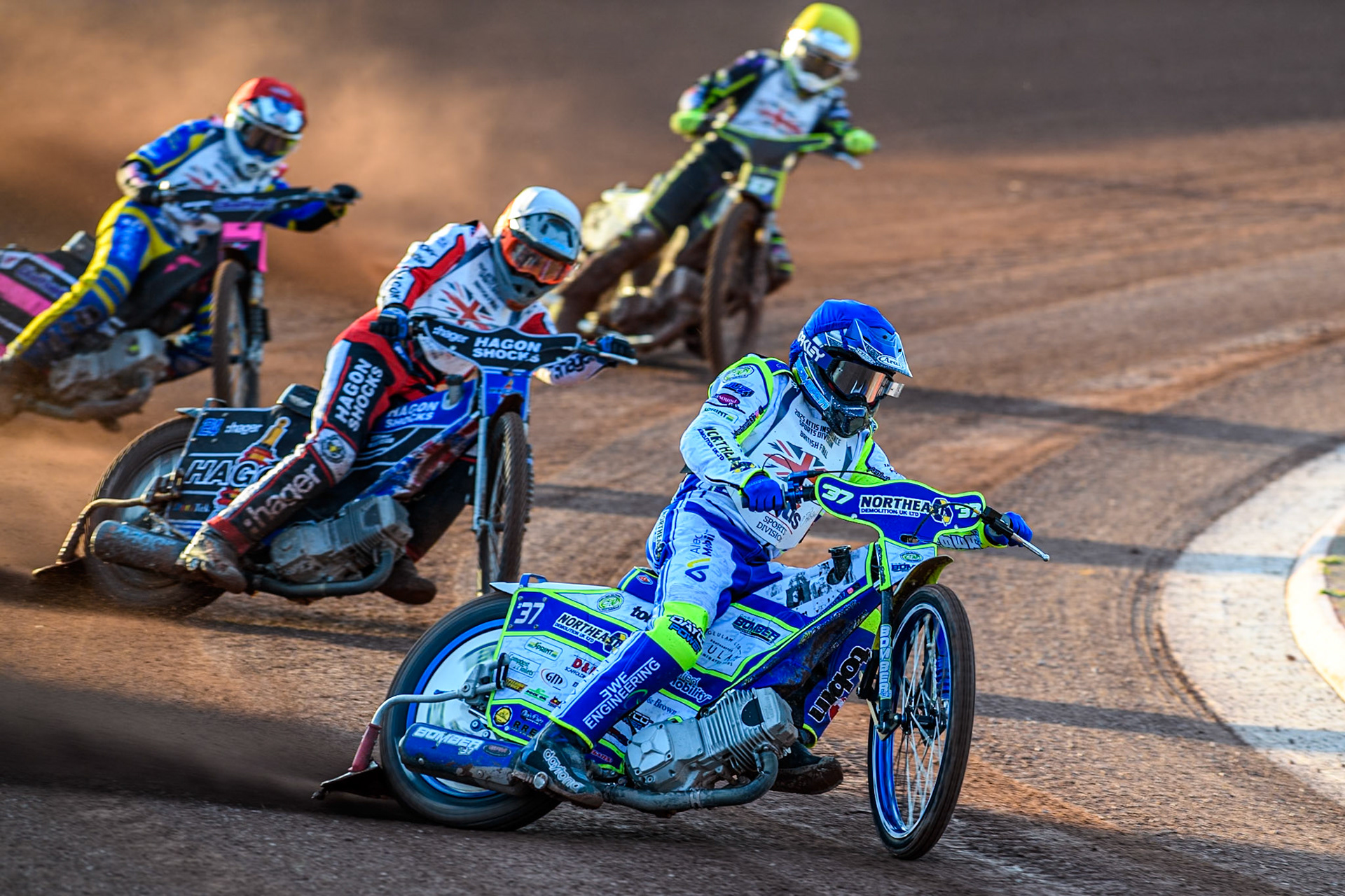 Chris Harris in Blue leading Jason Edwards in White, Leon Flint in Red and Tom Brennan in Yellow during the Attis Insurance Sports Division British Final at the National Speedway Stadium, Manchester on Monday 12th May 2025. (Photo: Ian Charles | MI News)