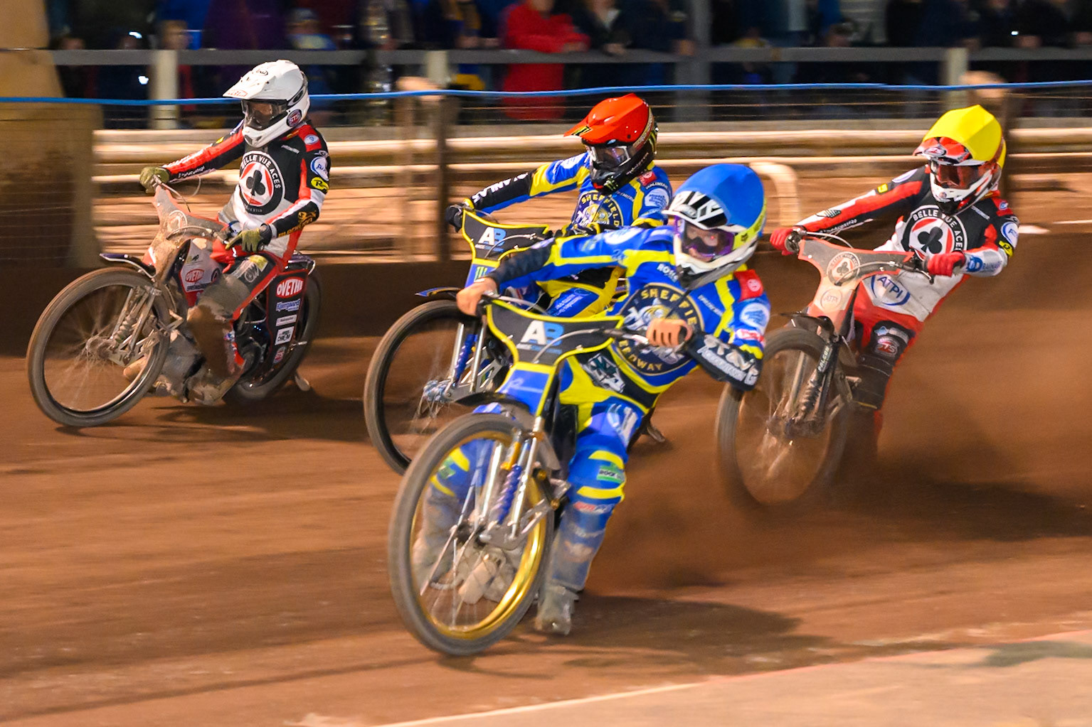 Anders Rowe of Sheffield Tigers in Blue leading Zach Cook of Belle Vue Aces in Yellow, Jack Holder of Sheffield Tigers  in Red and Peter Kildemand of Belle Vue Aces in White during the Knockout Cup Northern Section match between Sheffield Tigers and Belle Vue Aces at Owlerton Stadium, Sheffield on Thursday 2nd April 2026. (Photo: Ian Charles | MI News)