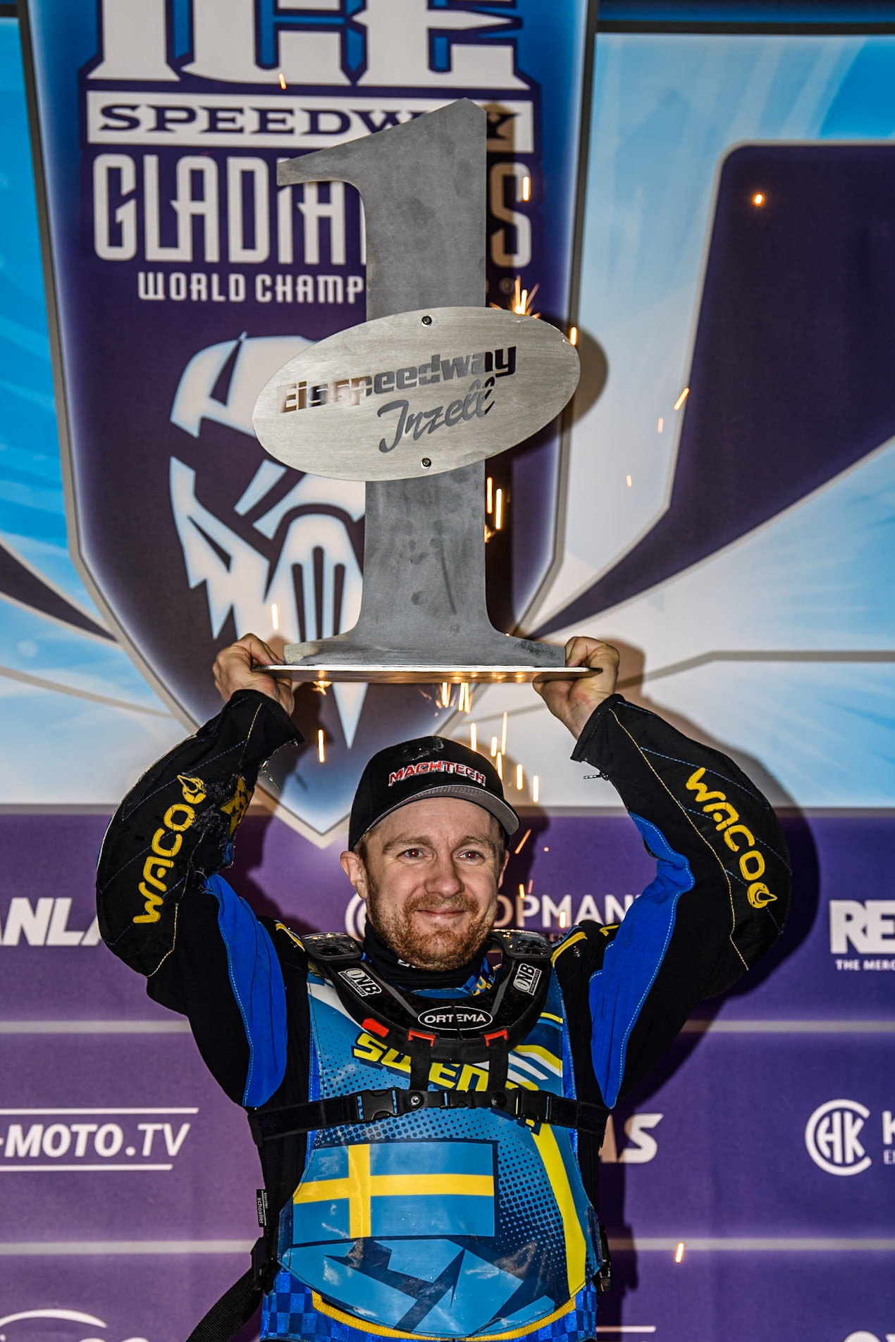 Martin Haarahiltunen raises the trophy after his win during the Ice Speedway Gladiators World Championship Final 2 at Max-Aicher-Arena, Inzell on Sunday 16th March 2025. (Photo: Ian Charles | MI News)