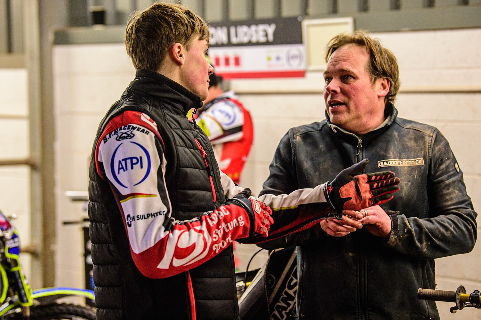 Norick Blodorn  (left) chats with his mechanic during the SGB Premiership match between Belle Vue Aces and Sheffield Tigers at the National Speedway Stadium, Manchester on Monday 27th March 2023. (Photo: Ian Charles | MI News)