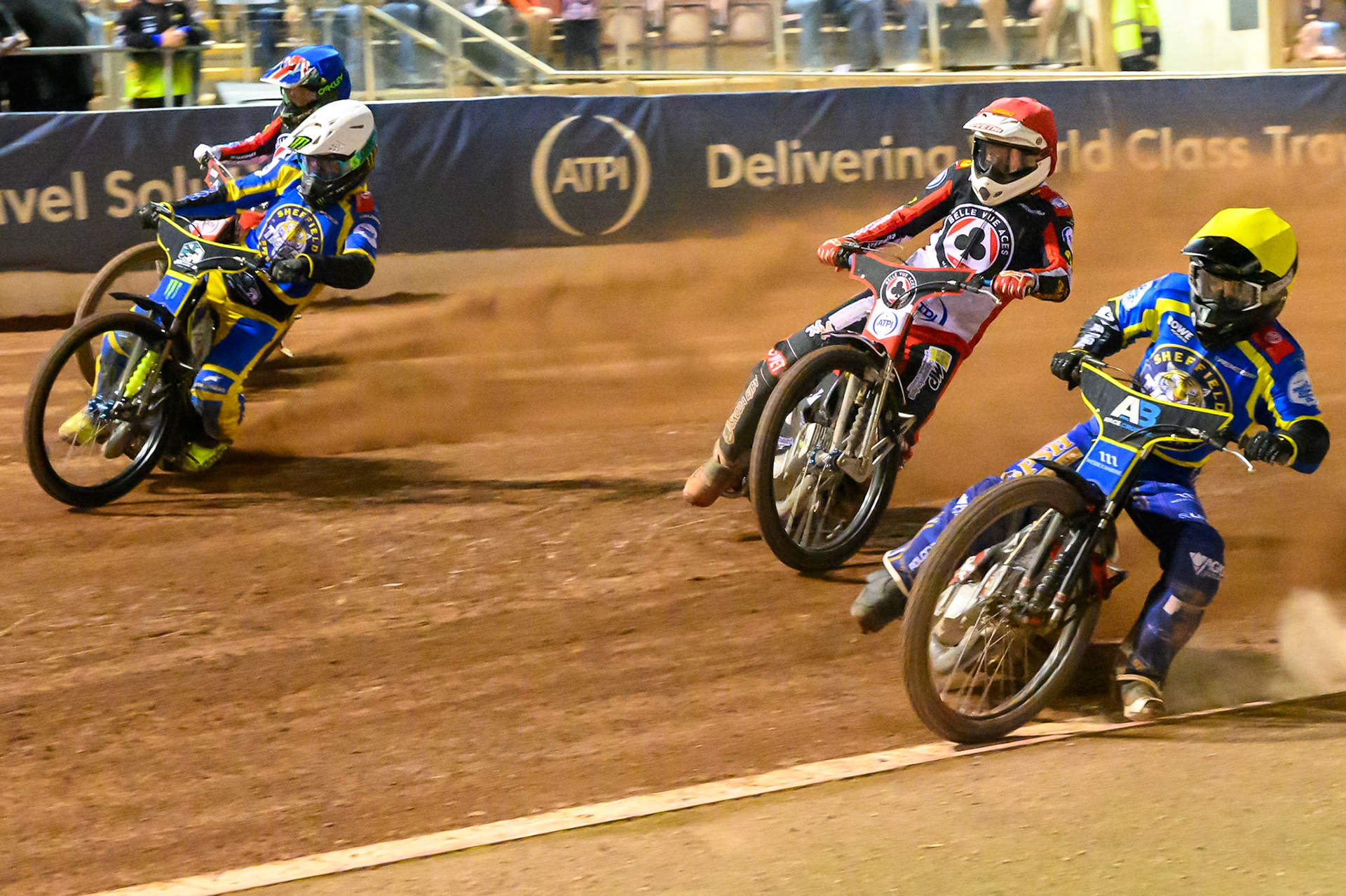 Ben Cook, Guest Rider for Sheffield Tigers in Yellow on the inside of Peter Kildemand of Belle Vue Aces in Red , Chris Holder of Sheffield Tigers in White  and William Cairns of Belle Vue Aces in Blue during the Rowe Motor Oil Premiership match between Belle Vue Aces and Sheffield Tigers at the National Speedway Stadium, Manchester on Monday 14th September 2026. (Photo: Ian Charles | MI News)