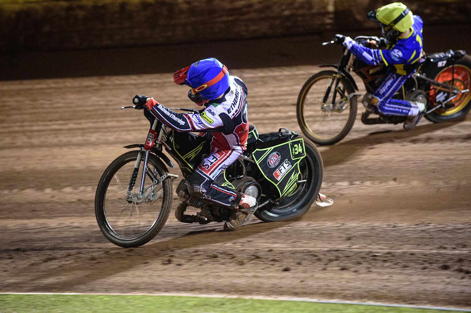 MANCHESTER, UK. OCT 7TH  Jye Etheridge (Blue) passes Danyon Hume  (Yellow) during the SGB Premiership Play off Semi-Final Second Leg between Belle Vue Aces and Sheffield Tigers at the National Speedway Stadium, Manchester on Thursday 7th October 2021. (Credit: Ian Charles | MI News)