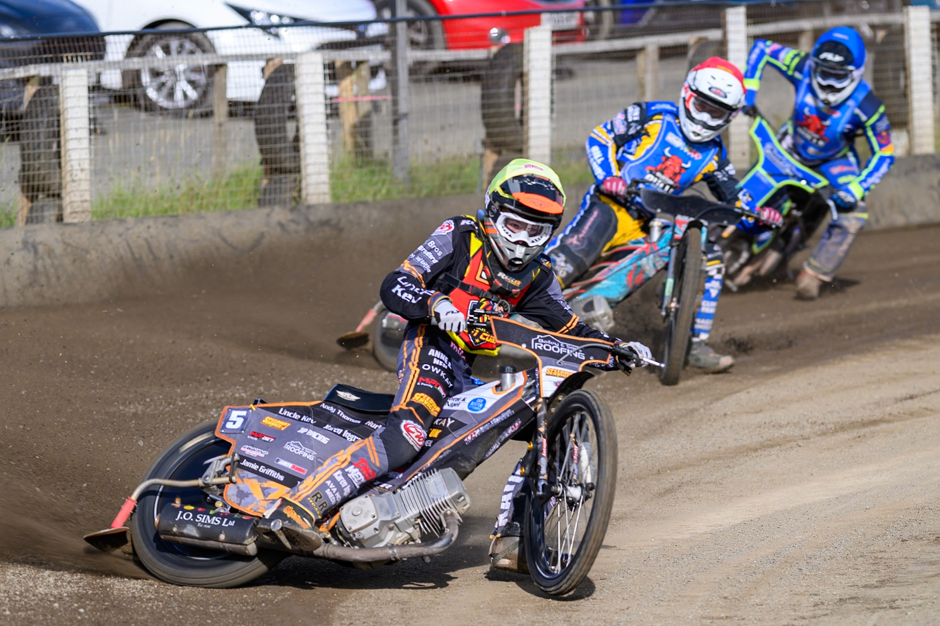 Ryan Ingram of Leicester Lion Cubs   in Yellow leading Alfie Bowtell of Buxton Bulls  in Red and Arran Butcher of Buxton Bulls   in Blue during the WSRA National Development League match between Buxton Bulls and Leicester Lion Cubs at Hi-Edge Speedway, Buxton on Sunday 4th October 2026. (Photo: Ian Charles | MI News)