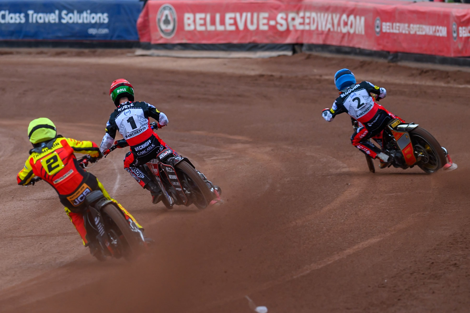 Dan Thompson of Leicester Lions in Yellow chases Brady Kurtz of Belle Vue Aces in Red and Norick Blödorn of Belle Vue Aces in Blue during the Rowe Motor Oil Premiership match between Belle Vue Aces and Leicester Lions at the National Speedway Stadium, Manchester on Monday 15th June 2026. (Photo: Ian Charles | MI News)