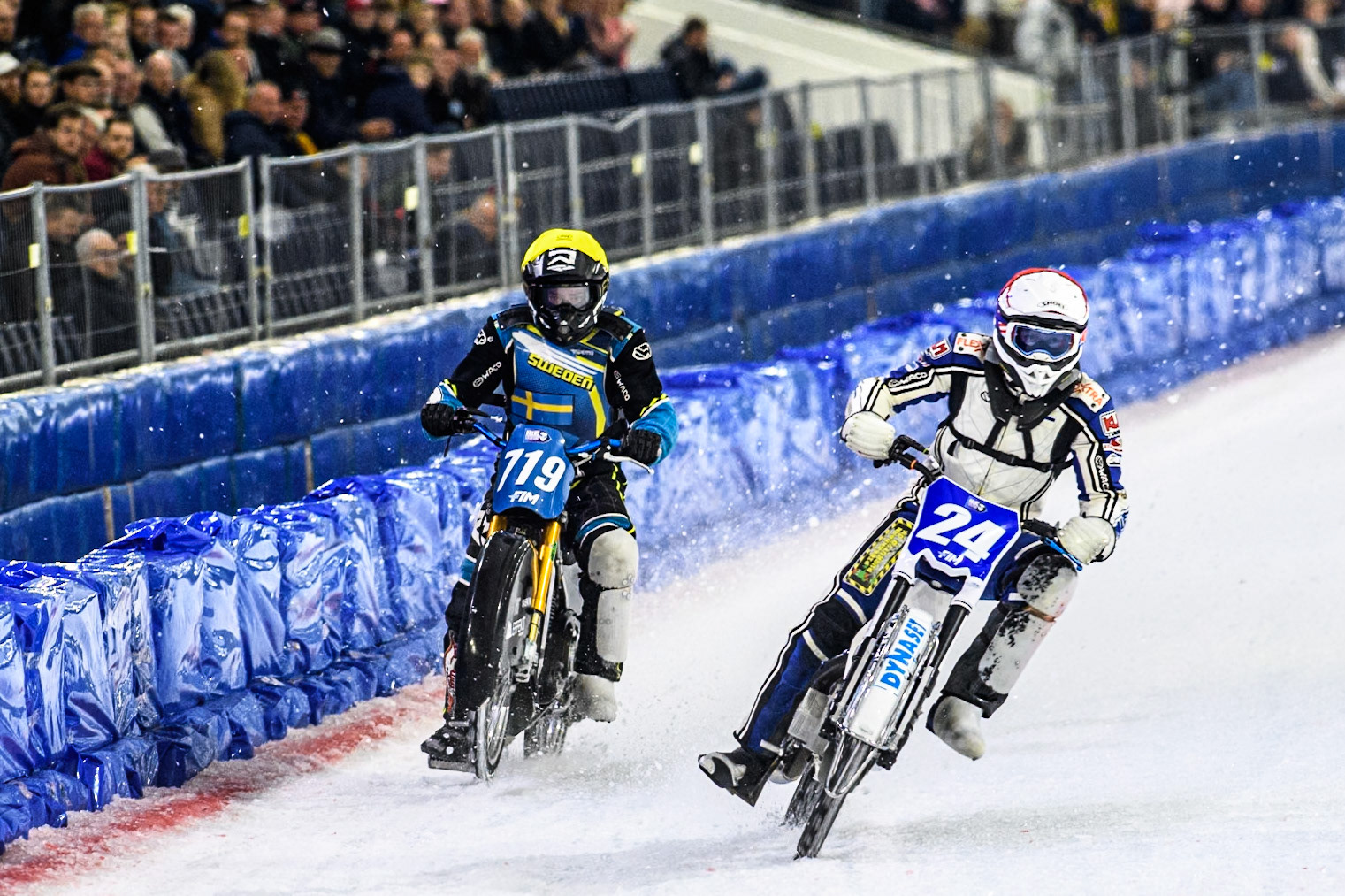Max Koivula (24) of Finland in White passes Filip Jäger (719) of Sweden in Yellow during the FIM Ice Speedway Gladiators World Championship, Final 4 at the Ice Stadium, Thialf, Heerenveen on Sunday 6th April 2025. (Photo: Ian Charles | MI News)