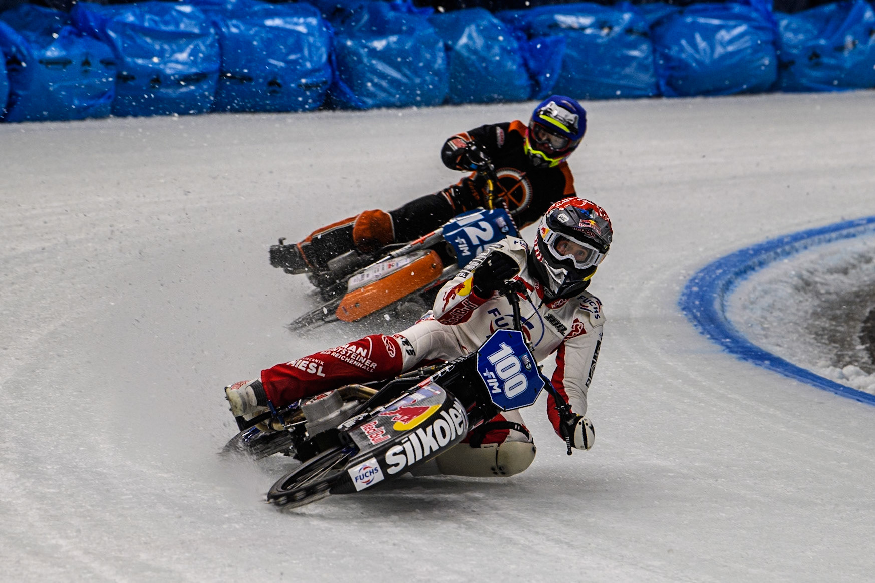 Franky Zorn (100) of Austria in Red leading Sebastian Reitsma (125) of The Netherlands in Blue during the Ice Speedway Gladiators World Championship Final 1 at Max-Aicher-Arena, Inzell on Saturday 15th March 2025. (Photo: Ian Charles | MI News)