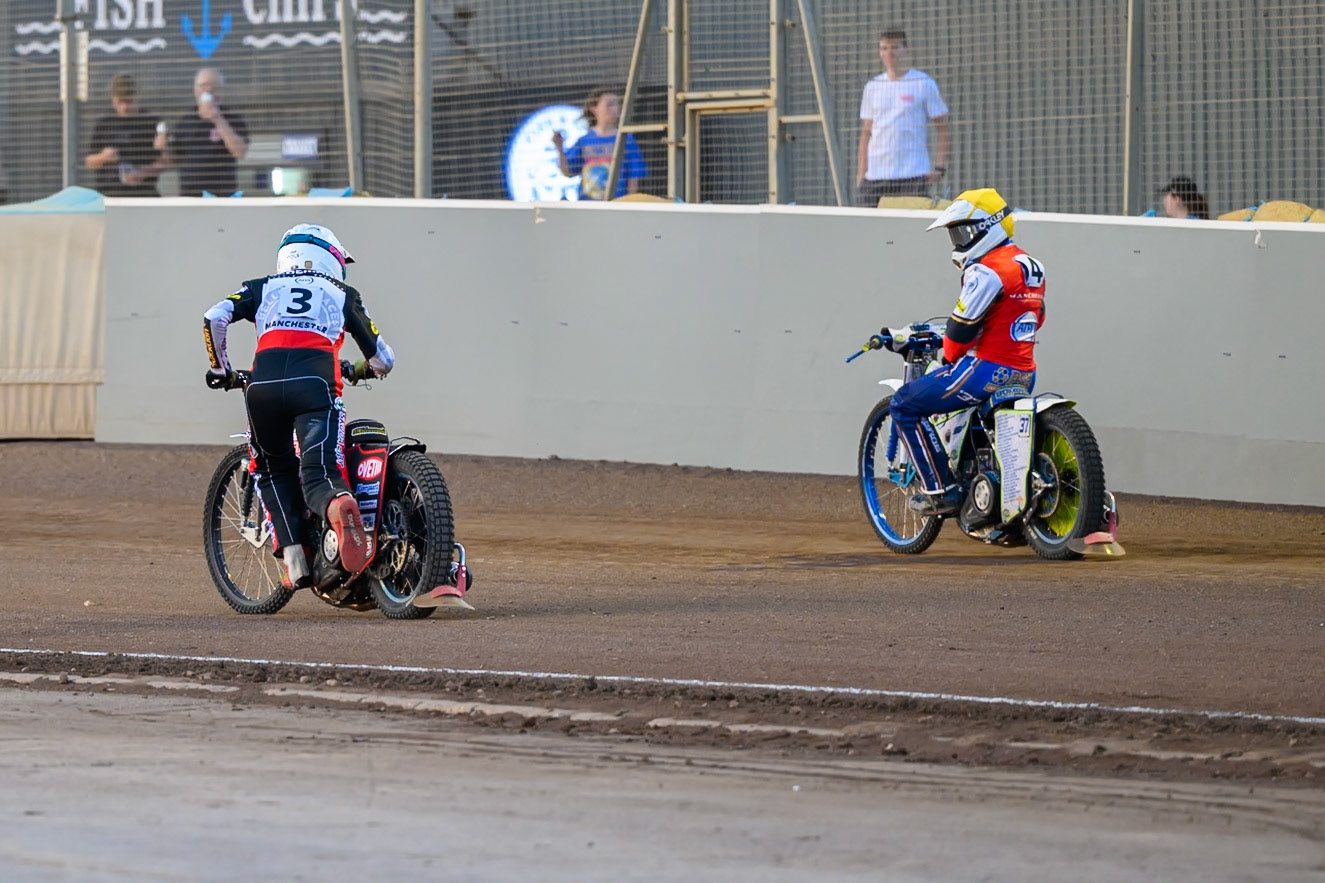 Peter Kildemand of Belle Vue Aces in White  starts to push his bike home to score the final point in Heat 7 as Chris Harris Guest Rider for Belle Vue Aces  looks on during the Rowe Motor Oil Premiership match between Northampton Foxes and Belle Vue Aces at Northampton International Shaleway, Northampton on Thursday 13th August 2026. (Photo: Ian Charles | MI News)