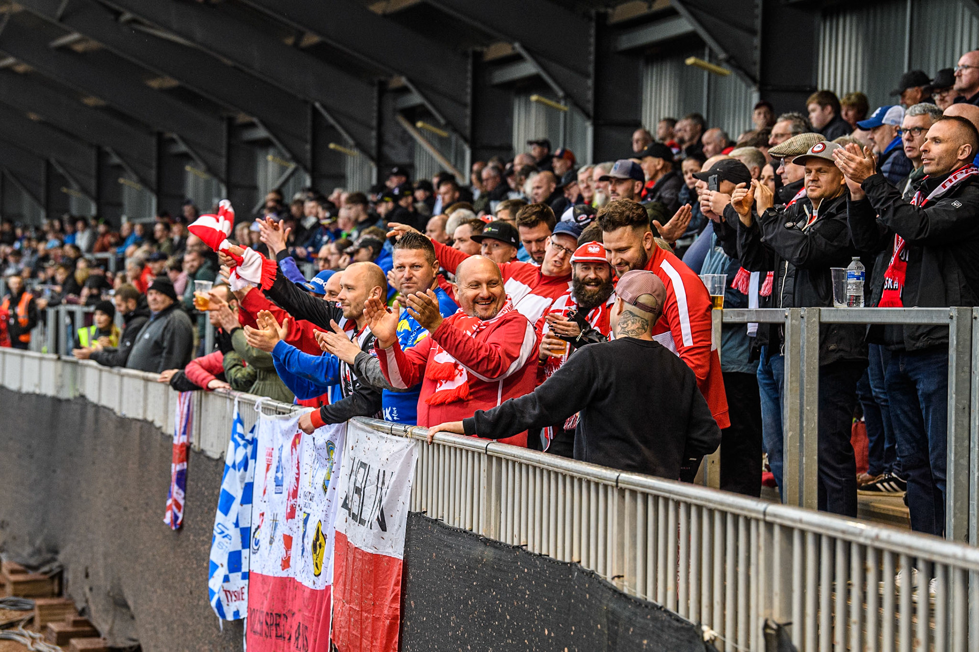 Polish fans celebrate their heat win during the Monster Energy FIM Speedway of Nations 2 (Under 21) Final at the National Speedway Stadium, Manchester on Friday 12th July 2024. (Photo: Ian Charles | MI News)