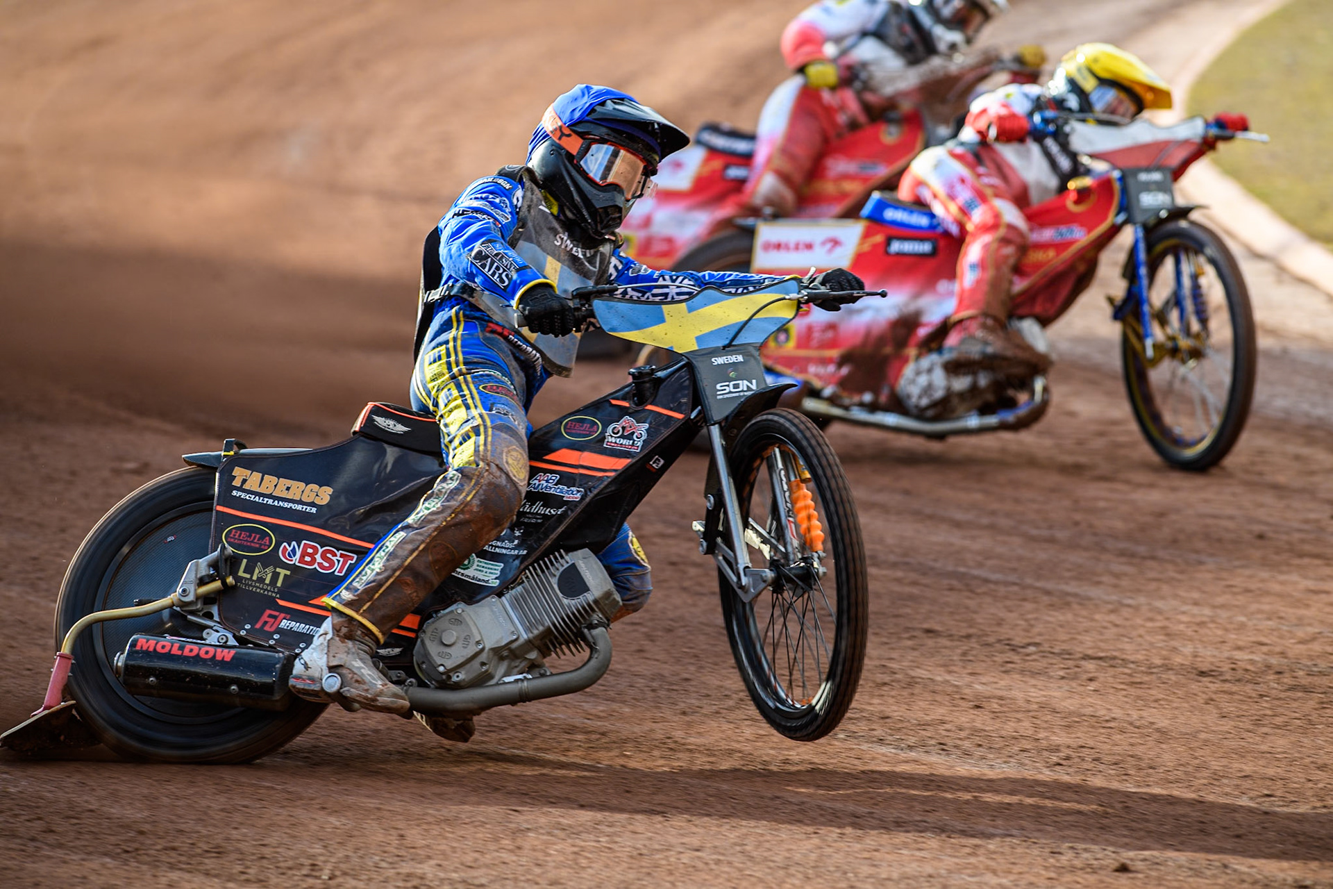 Jacob Thorssell of Sweden picks up some drive ahead of Bartosz Zmarzlik of Poland in Yellow during the Monster Energy FIM Speedway of Nation Final at the National Speedway Stadium, Manchester on Saturday 13th July 2024. (Photo: Ian Charles | MI News)