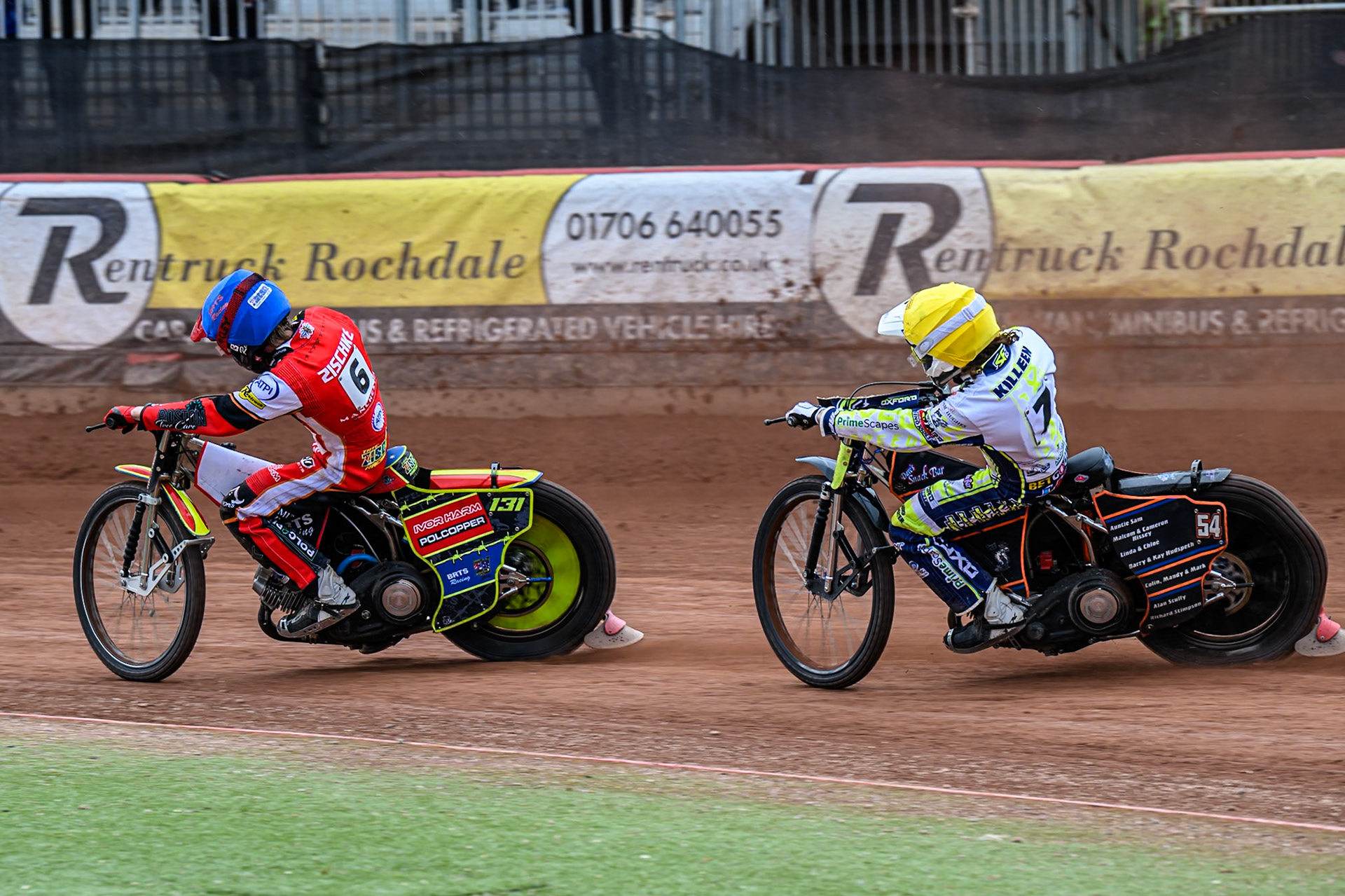 Oxford Spires' Luke Killeen in Yellow chases Belle Vue Aces' Tate Zischke in Blue during the Rowe Motor Oil Premiership match between Belle Vue Aces and Oxford Spires at the National Speedway Stadium, Manchester on Monday 26th May 2025. (Photo: Ian Charles | MI News)
