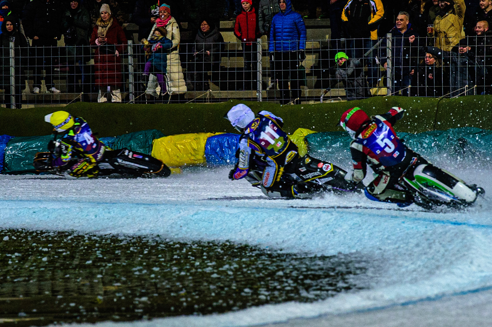 Andrej Divis (Red) chases Christoph Kirchner (White) and Max Neidermaier (Yellow) during the German Individual Ice Speedway Championship at Horst-Dohm-Eisstadion, Berlin on Friday 3rd March 2023. (Photo: Ian Charles | MI News)