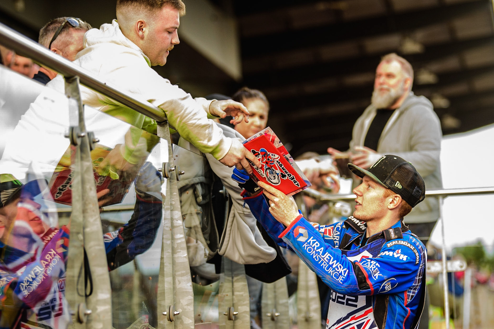 Dan Bewley signs an autograph for a fan between races during the Sports Insure British Speedway Final, at the National Speedway Stadium, Manchester, on Sunday 18th September 2022. (Credit: Ian Charles | MI News )