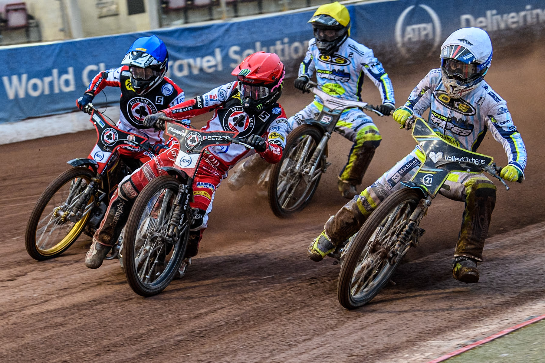 Oxford Spires' Rohan Tungate in White rides inside Belle Vue Aces' Dan Bewley in Red and Belle Vue Aces' Connor Mountain in Blue with Oxford Spires' Erik Riss in Yellow behind during the Rowe Motor Oil Premiership match between Belle Vue Aces and Oxford Spires at the National Speedway Stadium, Manchester on Monday 13th May 2024. (Photo: Ian Charles | MI News)