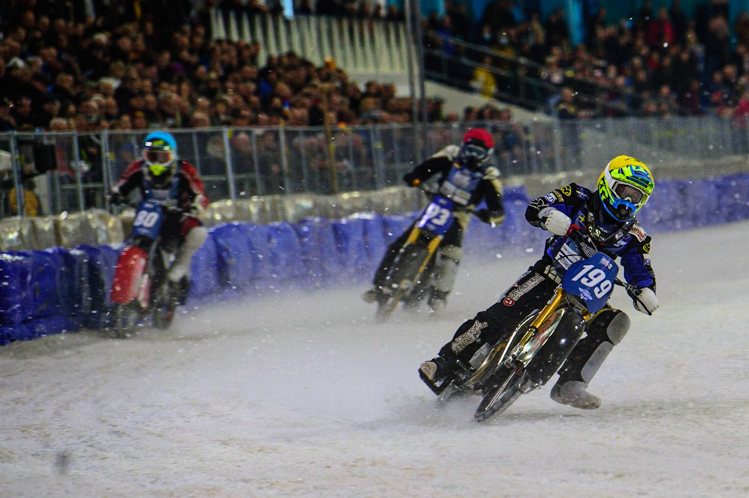 HEERENVEEN, NL. Martin Hååruhiltunen (199)  (Yellow) leads Jiri Wildt (80) (Blue) and Franz Mayerbüchler (93) (Red)  during the FIM Ice Speedway Gladiators World Championship Final 4 at Ice Rink Thialf, Heerenveen on Sunday  3 April 2022. (Credit: Ian Charles | MI News)