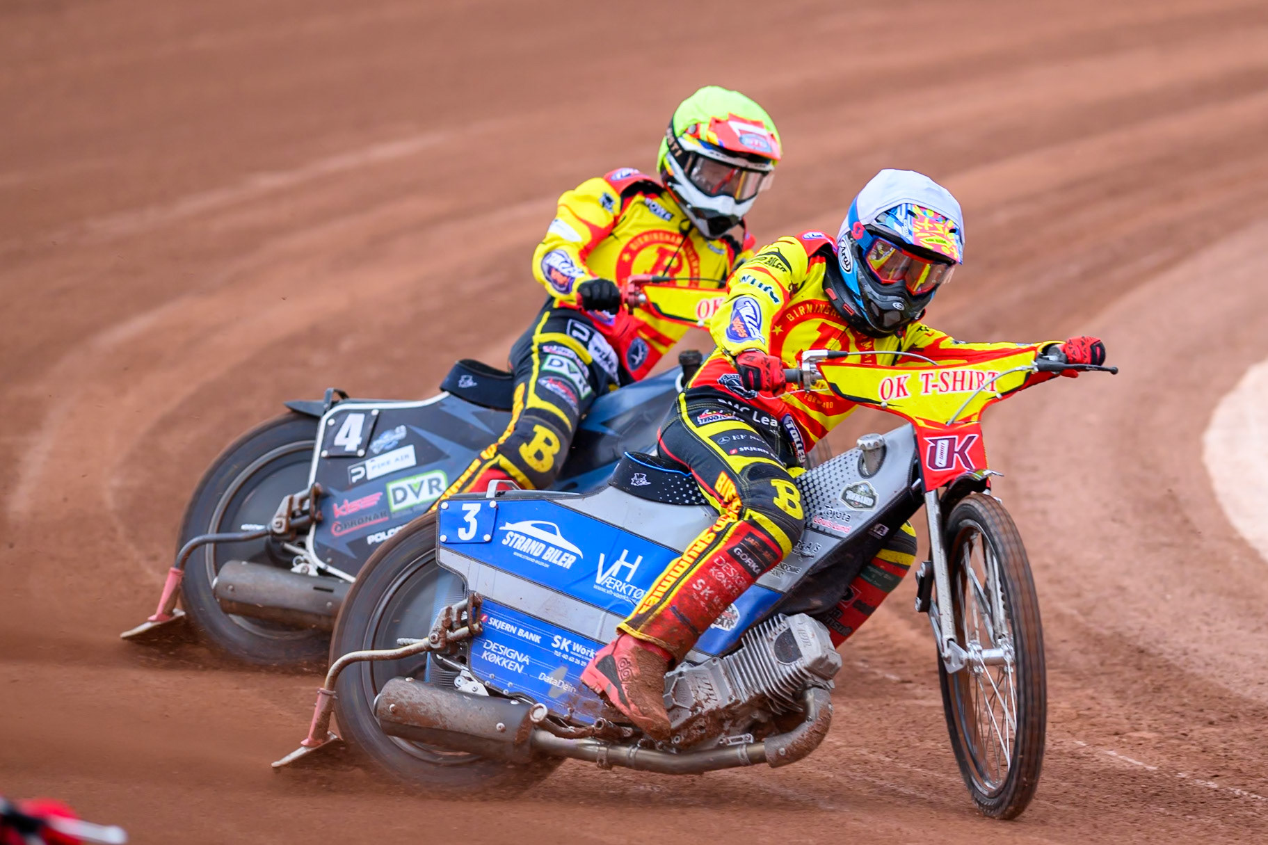 Birmingham Brummies' Jonas Jeppesen  in White leading team mate  Keynan Rew  in Yellow during the Rowe Motor Oil Premiership match between Belle Vue Aces and Birmingham Brummies at the National Speedway Stadium, Manchester on Monday 7th July 2025. (Photo: Ian Charles | MI News)