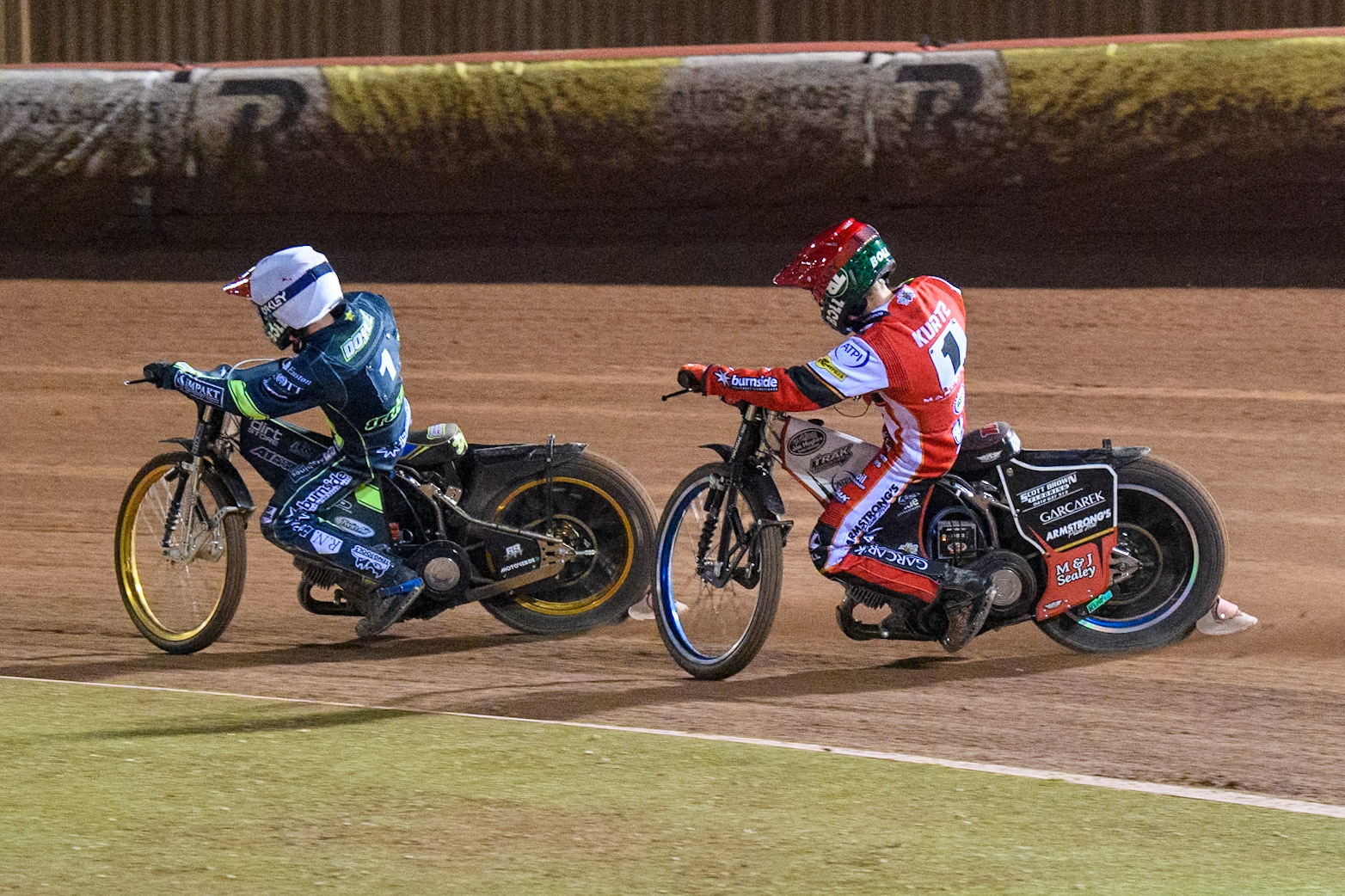 Brady Kurtz of Belle Vue Aces in Red chases Jason Doyle of Ipswich Witches in White during the Premiership Cup Quarter Final 1st Leg match between Belle Vue Aces and Ipswich Witches at the National Speedway Stadium, Manchester on Monday 24th March 2025. (Photo: Ian Charles | MI News)