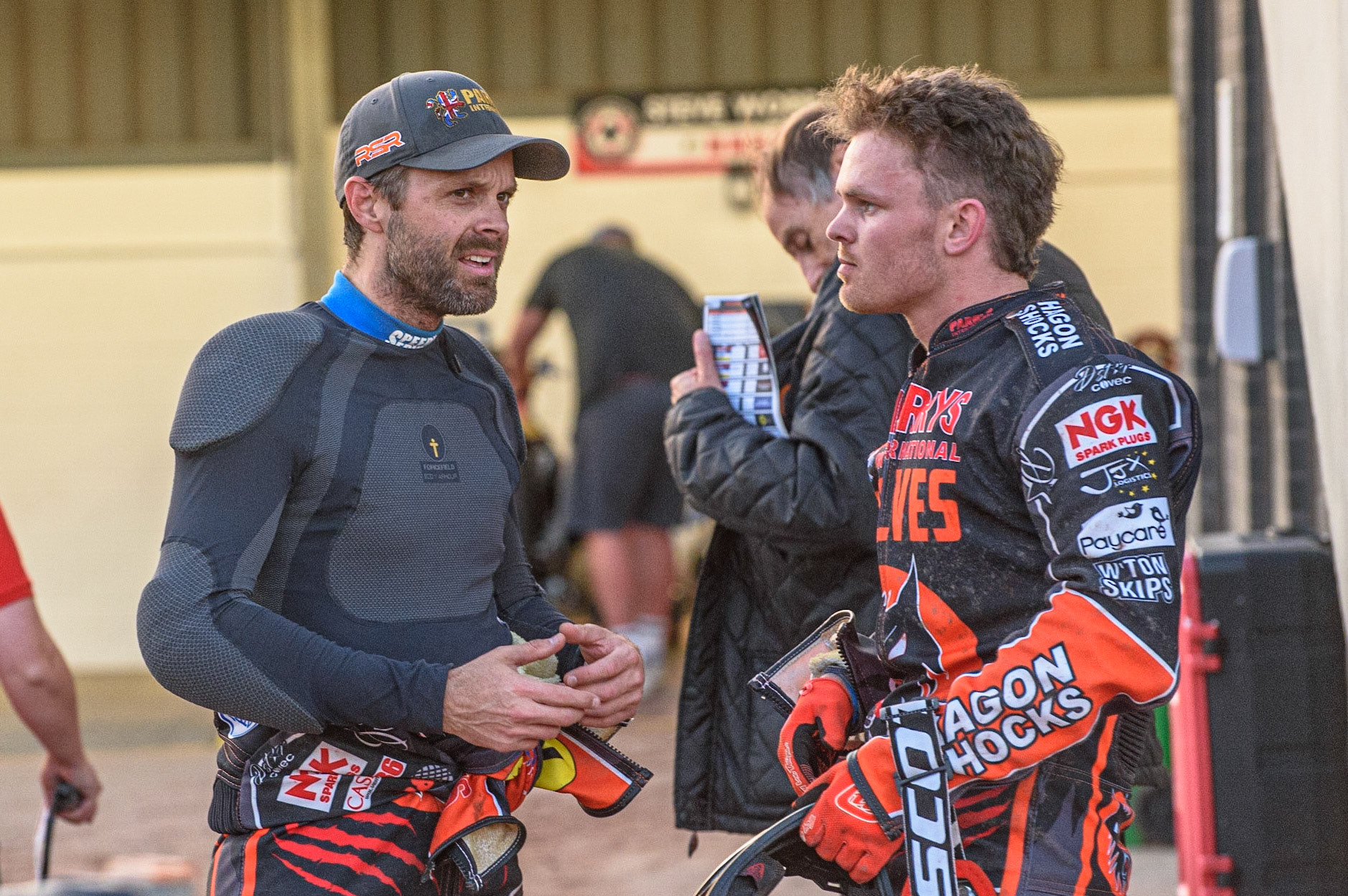 MANCHESTER, UK. JULY 15TH   Rory Schlein  (left) chats with team mate Ryan Douglas  during the SGB Premiership match between Belle Vue Aces and Wolverhampton Wolves at the National Speedway Stadium, Manchester on Thursday 15th July 2021. (Credit: Ian Charles | MI News)