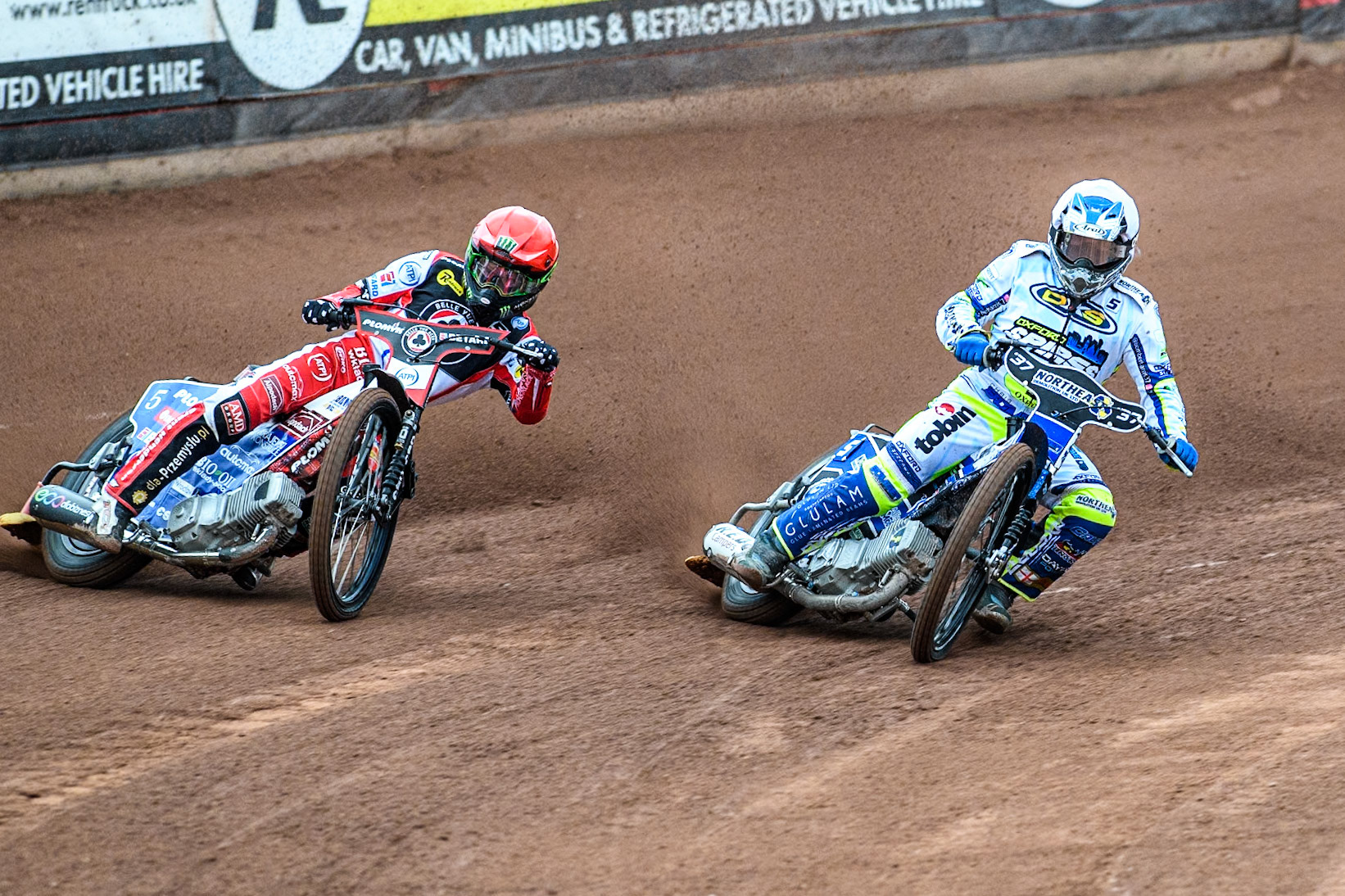 Belle Vue Aces' Dan Bewley  in Red rides outside Oxford Spires' Chris Harris   in White during the Rowe Motor Oil Premiership match between Belle Vue Aces and Oxford Spires at the National Speedway Stadium, Manchester on Monday 22nd July 2024. (Photo: Ian Charles | MI News)