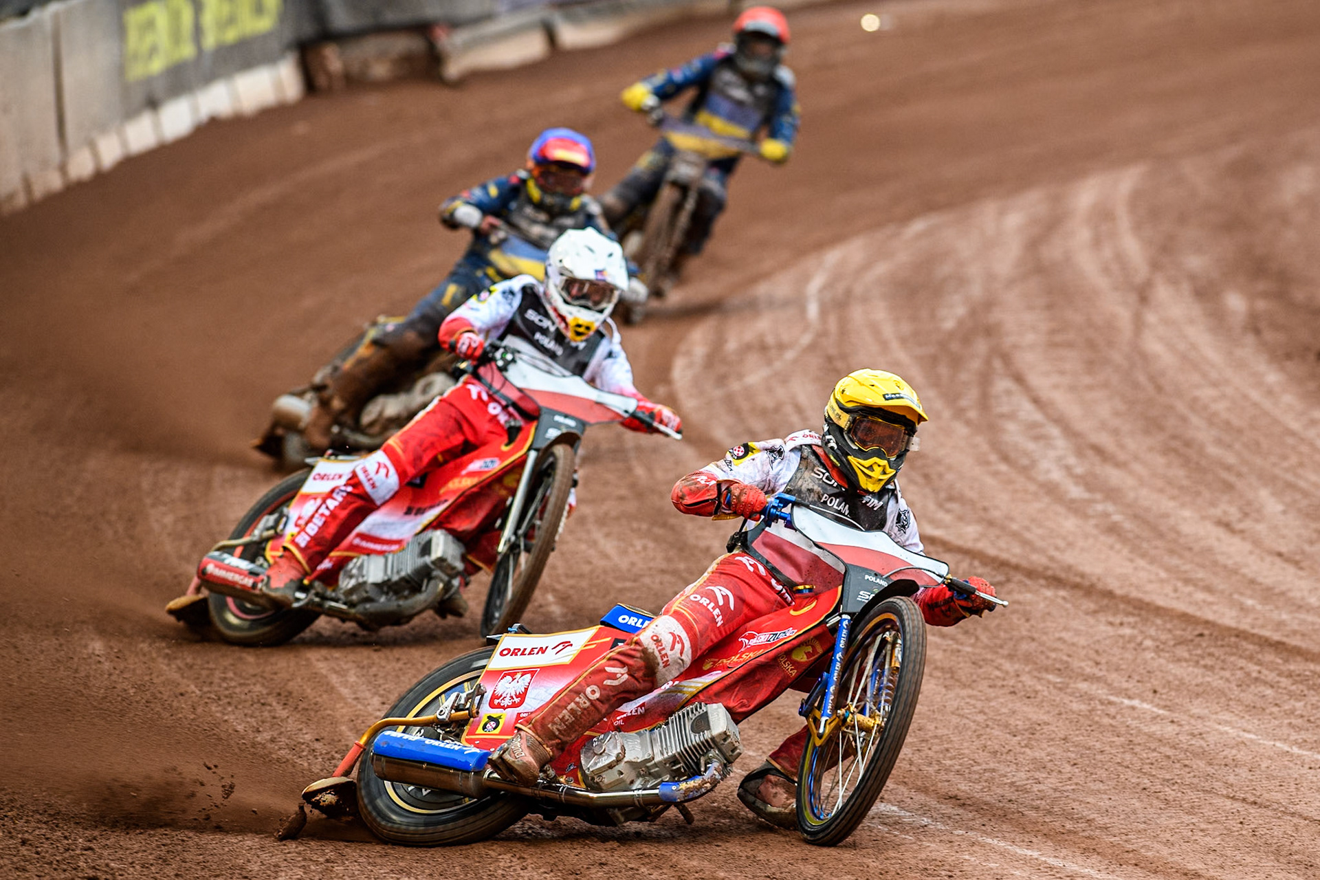 Ukraine v Poland: Bartosz Zmarzlik of Poland in Yellow leading Dominik Kubera of Poland in White with Marko Levishyn of Ukraine in Blue and Stanislav Melnychuk of Ukraine in Red behind during the Monster Energy FIM Speedway of Nations Semi-Final 1 at the National Speedway Stadium, Manchester on Tuesday 9th July 2024. (Photo: Ian Charles | MI News)
