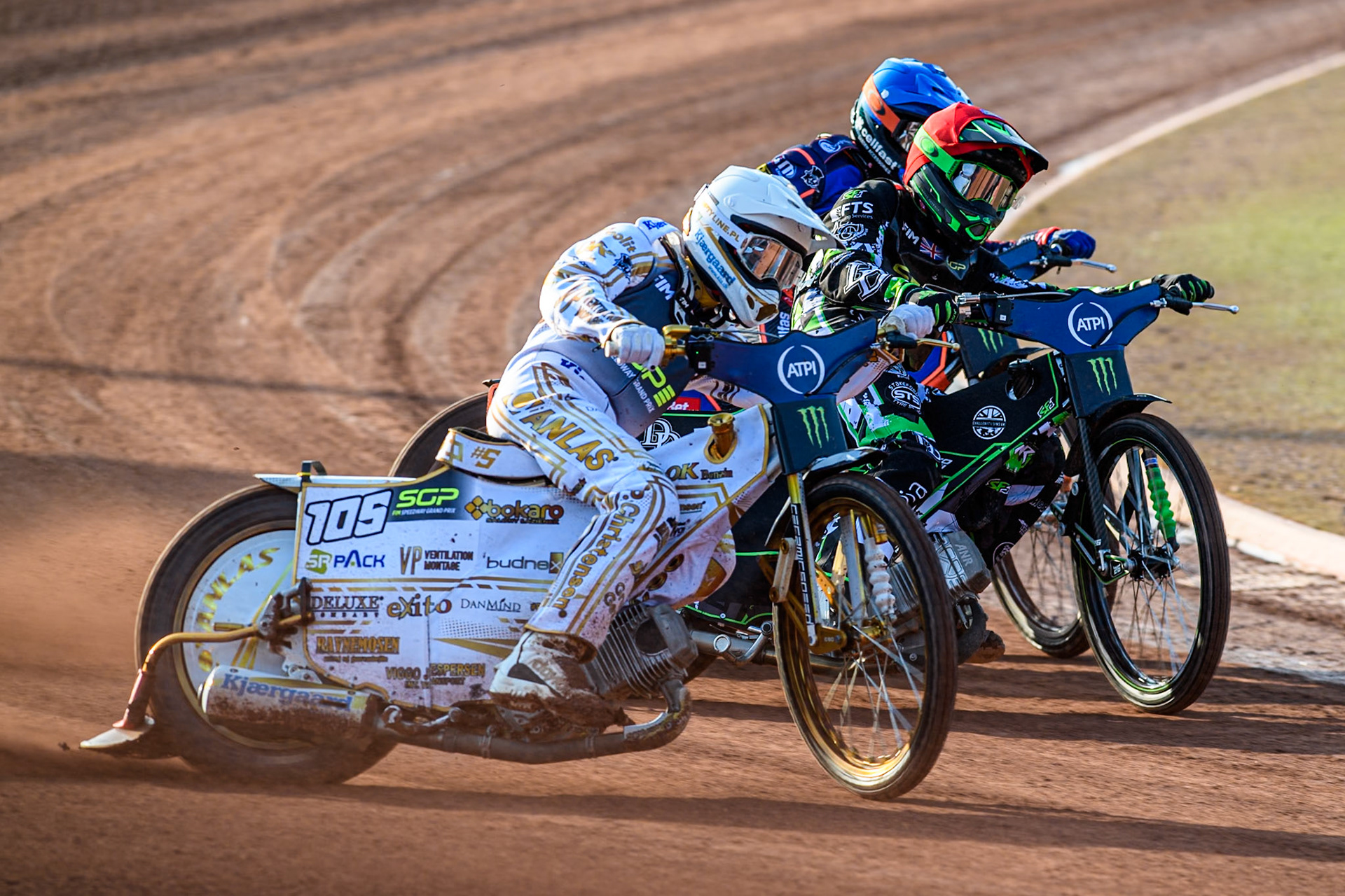 Anders Thomsen (105) of Denmark in White rides outside Wild Card Charles Wright (16) of Great Britain in Red and Andzejs Lebedevs (29) of Latvia in Blue during the ATPI FIM Speedway Grand Prix Round 5 at the National Speedway Stadium, Manchester, on Saturday 14th June 2025. (Photo: Ian Charles | MI News)