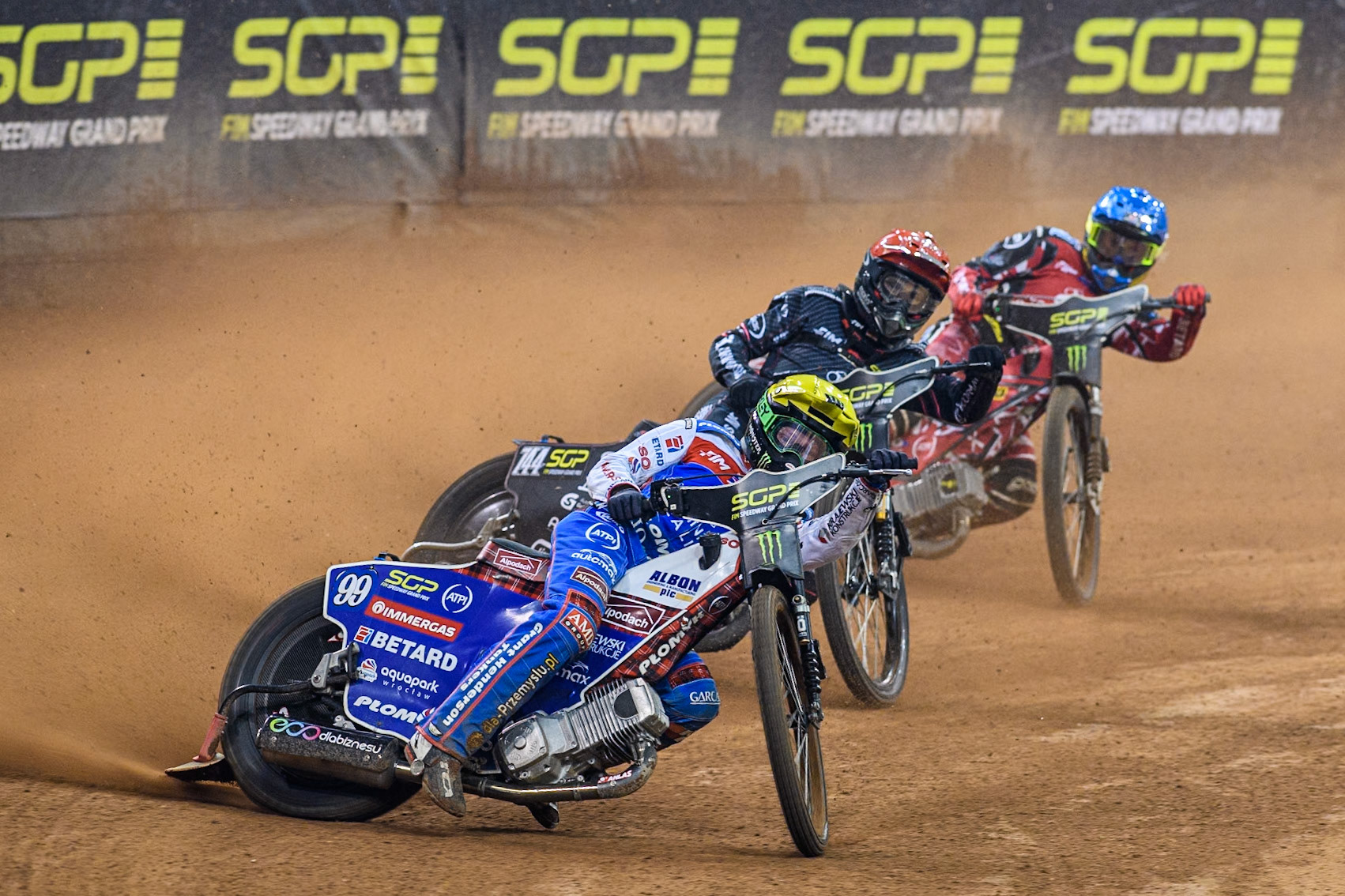 Daniel Bewley (99) of Great Britain in Yellow leading Kai Huckenbeck (744) of Germany in Red and Max Fricke (46) of Australia in Blue during the FIM Speedway Grand Prix of Great Britain at The Principality Stadium, Cardiff on Saturday 17th August 2024. (Photo: Ian Charles | MI News)