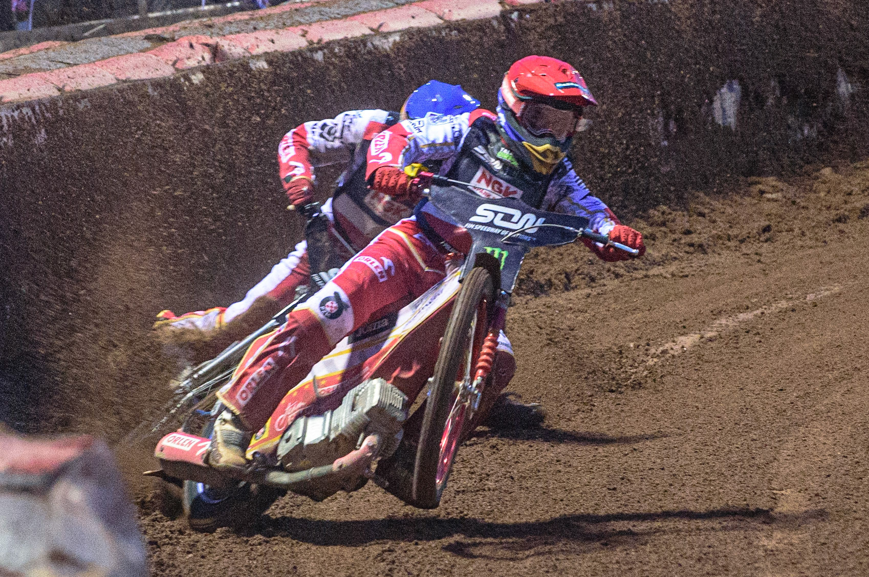 MANCHESTER, UK. OCT 17TH The moment Great Britain became champions as pl1(Red) causes team mate Maciej Janowski (Blue) to hit the dirt during the Monster Energy FIM Speedway of Nations at the National Speedway Stadium, Manchester on Sunday  17th October 2021. (Credit: Ian Charles | MI News)