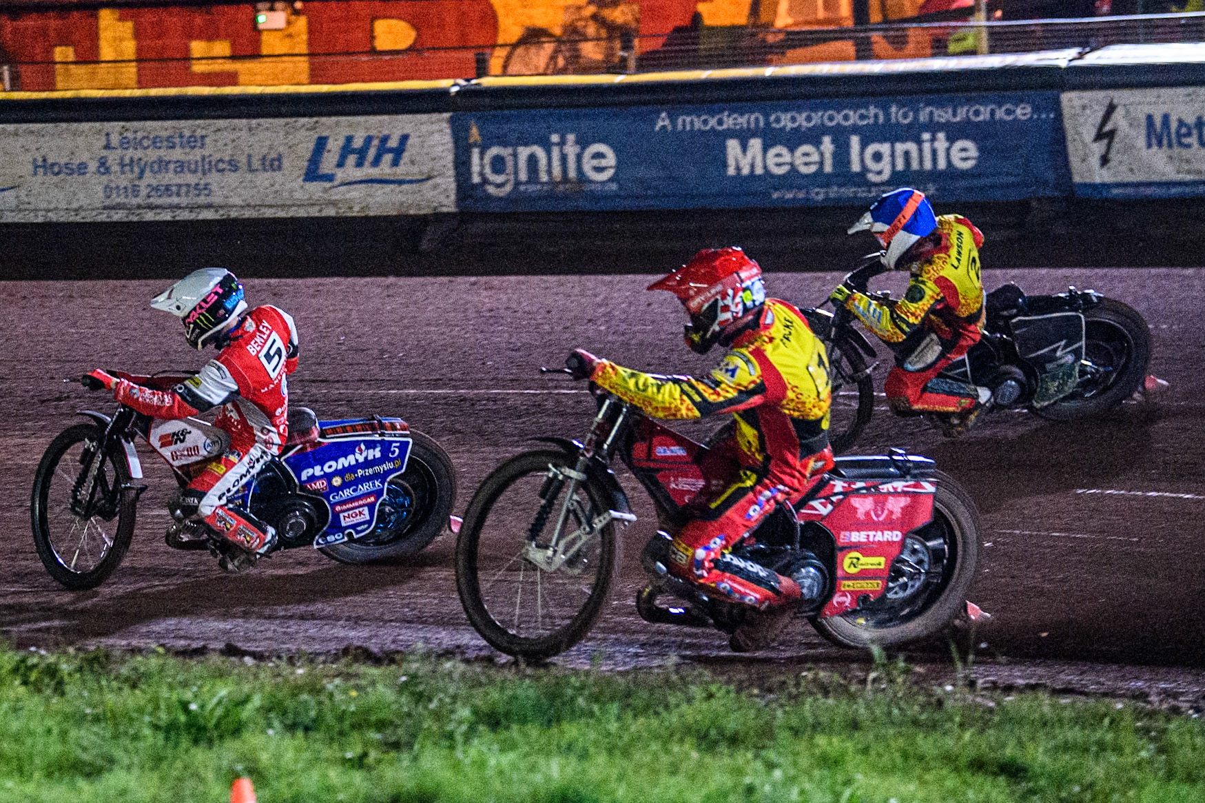 Belle Vue Aces' Dan Bewley in White leading Leicester Lions' Max Fricke in Red and Leicester Lions' Richard Lawson in Blue during the Rowe Motor Oil Premiership Grand Final 2nd Leg between Leicester Lions and Belle Vue Aces at the Pidcock Motorcycles Arena, Leicester on Thursday 26th September 2024. (Photo: Ian Charles | MI News)
