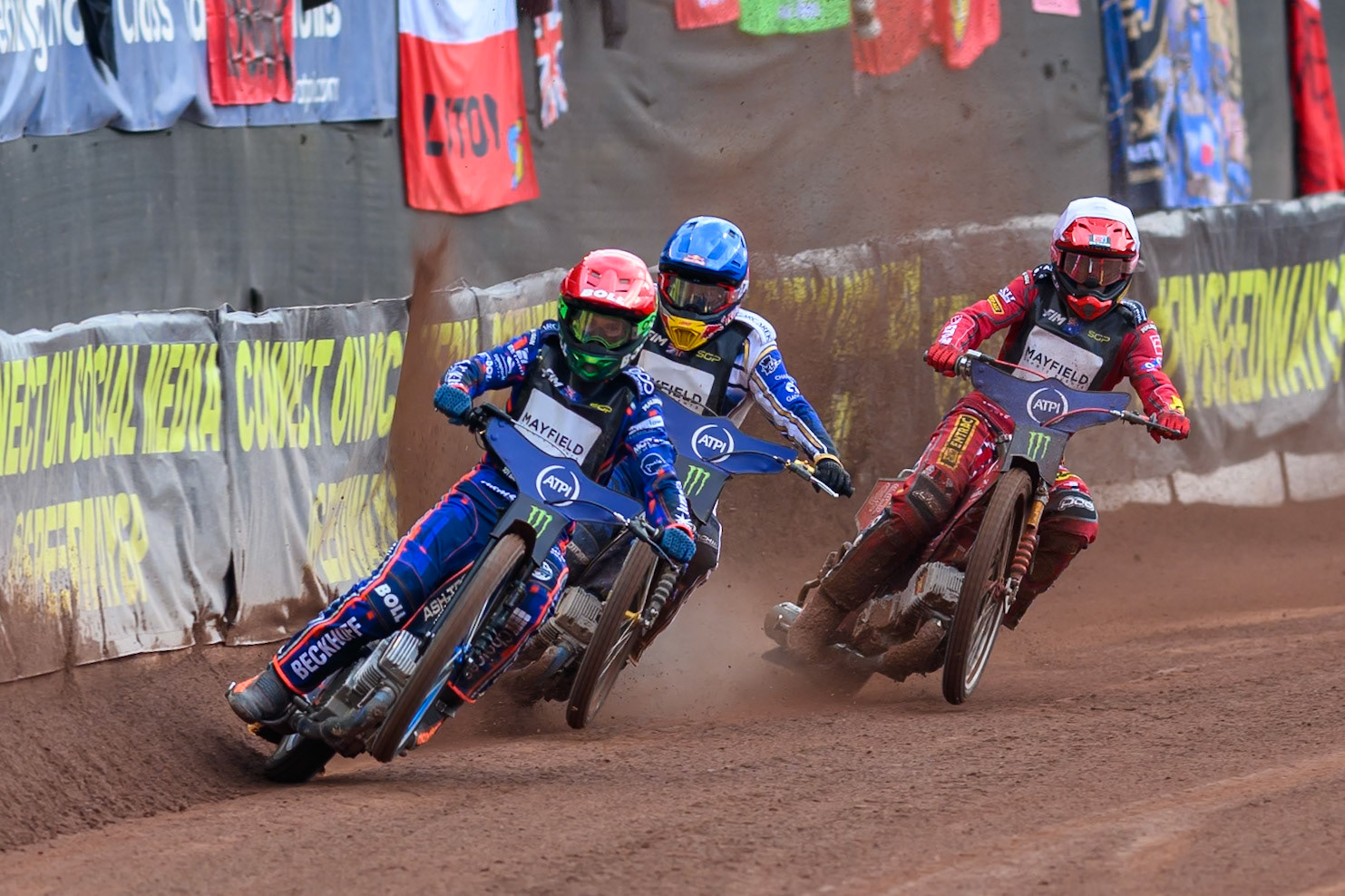Brady Kurtz (101) of Australia in Red picks up some drive leading Robert Lambert (505) of Great Britain in Blue and Max Fricke (46) of Australia in White during the ATPI  FIM Speedway GP of Manchester at the National Speedway Stadium, Manchester on Saturday 6th June 2026. (Photo: Ian Charles | MI News)