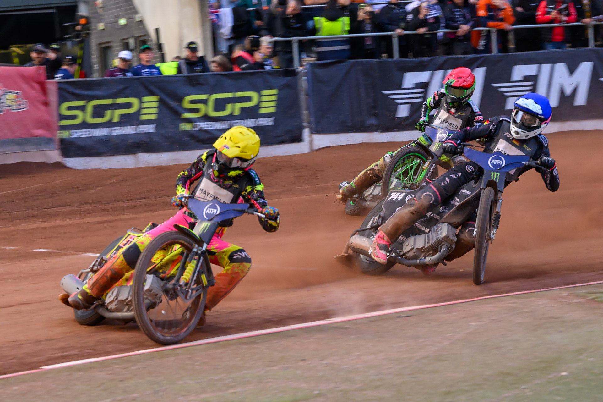 Michael Jepsen Jensen (52) of Denmark in Yellow leading Kai Huckenbeck (744) of Germany in Blue and Patryk Dudek (692) of Poland in Red during the ATPI  FIM Speedway GP of Manchester at the National Speedway Stadium, Manchester on Saturday 6th June 2026. (Photo: Ian Charles | MI News)