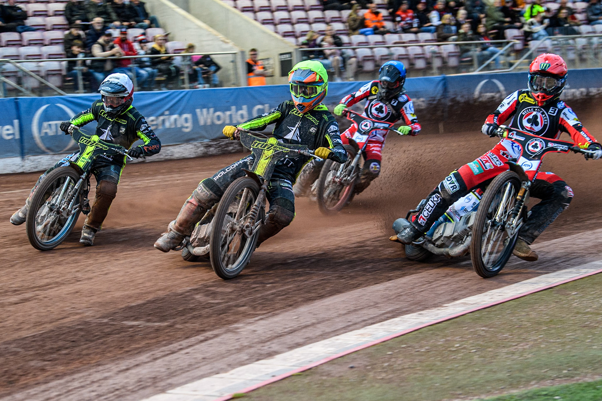 Ipswich Witches' Keynan Rew in Yellow leading Belle Vue Aces' Jaimon Lidsey  in Red and Ipswich Witches' Danny King in White with Belle Vue Aces' Connor Bailey  in Blue behind during the Rowe Motor Oil Premiership match between Belle Vue Aces and Ipswich Witches at the National Speedway Stadium, Manchester on Monday 1st July 2024. (Photo: Ian Charles | MI News)