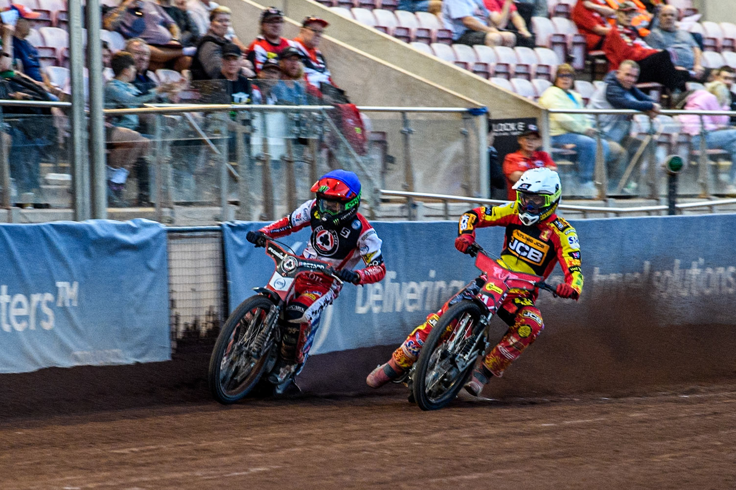 Belle Vue Aces' Dan Bewley in Blue rides outside Leicester Lions' Max Fricke in White during the Rowe Motor Oil Premiership match between Belle Vue Aces and Leicester Lions at the National Speedway Stadium, Manchester on Monday 24th June 2024. (Photo: Ian Charles | MI News)