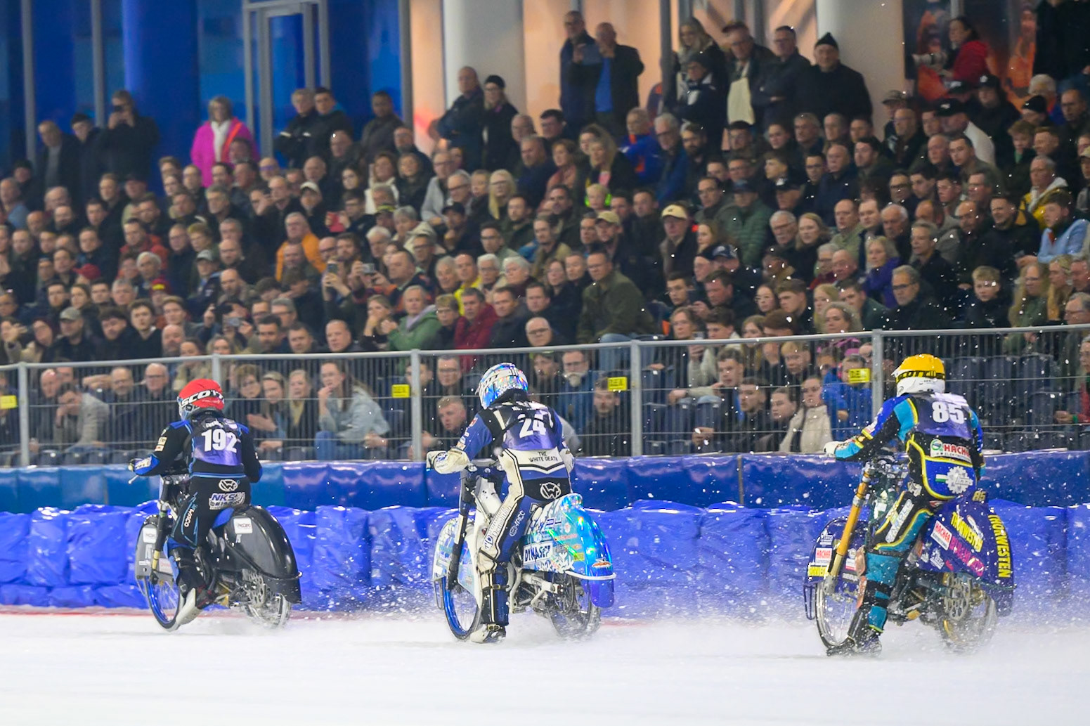 Luca Bauer (85) of Italy/Germany  in Yellow chases Max Koivula (24) of Finland  in White and Niclas Svensson (192) of Sweden  in Red in the final during the FIM Ice Speedway Gladiators World Championship Final 3 at Ice Rink Thialf, Heerenveen on Saturday 11th April 2026. (Photo: Ian Charles | MI News)