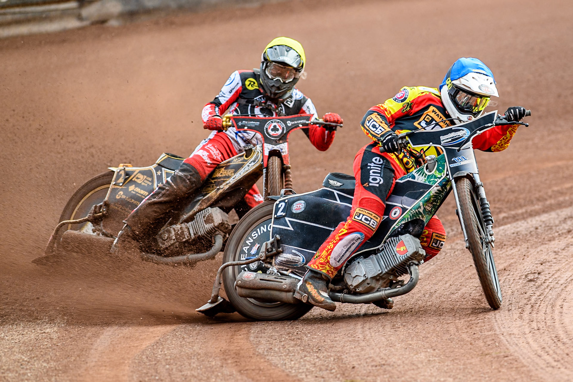 Leicester Lions' Richard Lawson in Blue leading Belle Vue Aces' Norick Blodorn in Yellow during the Rowe Motor Oil Premiership match between Leicester Lions and Belle Vue Aces at the Pidcock Motorcycles Arena, Leicester on Thursday 25th July 2024. (Photo: Ian Charles | MI News)
