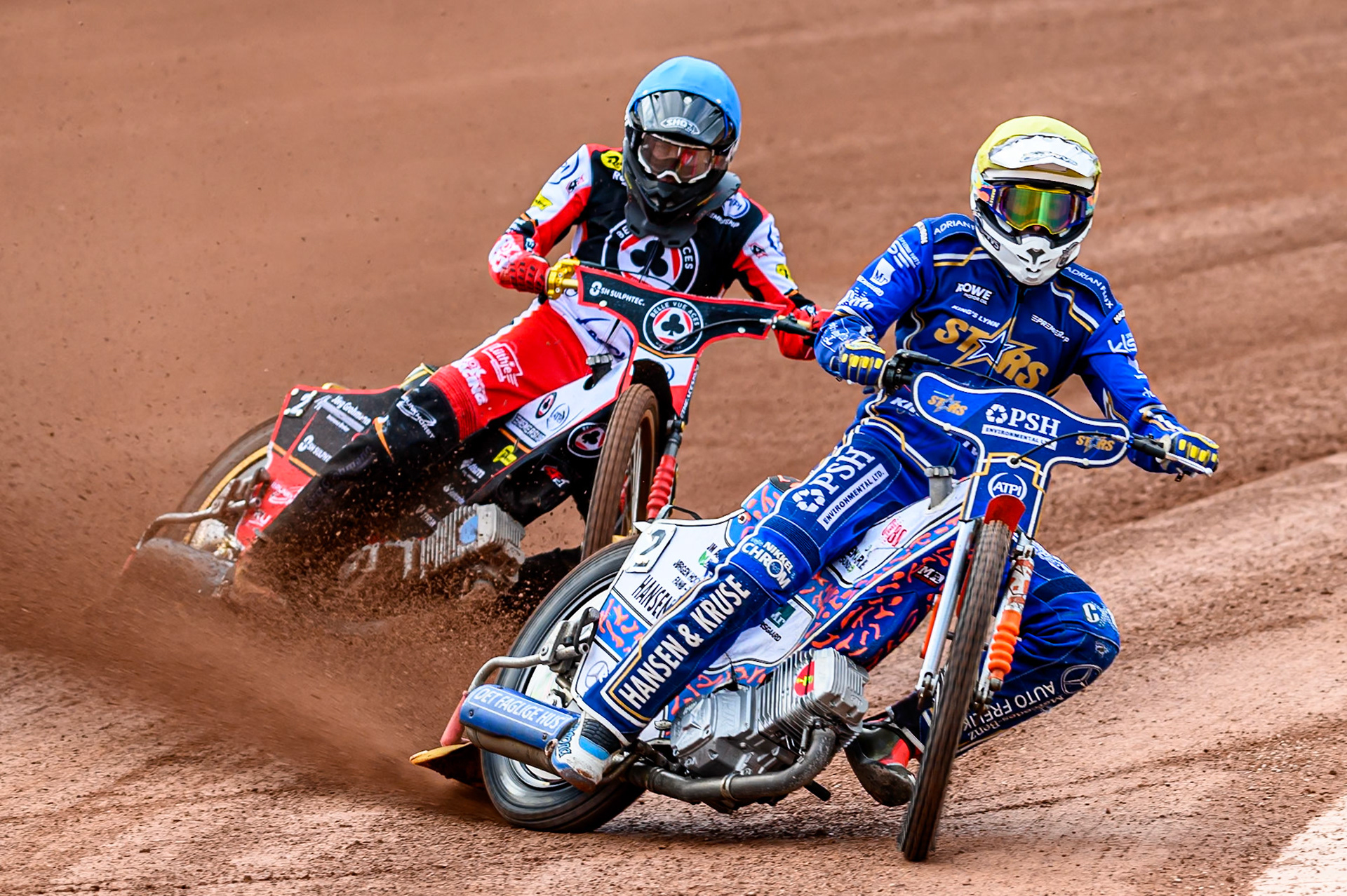 Kings Lynn Stars' Niels-Kristian Iversen in Yellow leading Belle Vue Aces' Norick Blödorn in Blue during the Rowe Motor Oil Premiership match between Belle Vue Aces and King's Lynn Stars at the National Speedway Stadium, Manchester on Monday 23rd June 2025. (Photo: Ian Charles | MI News)
